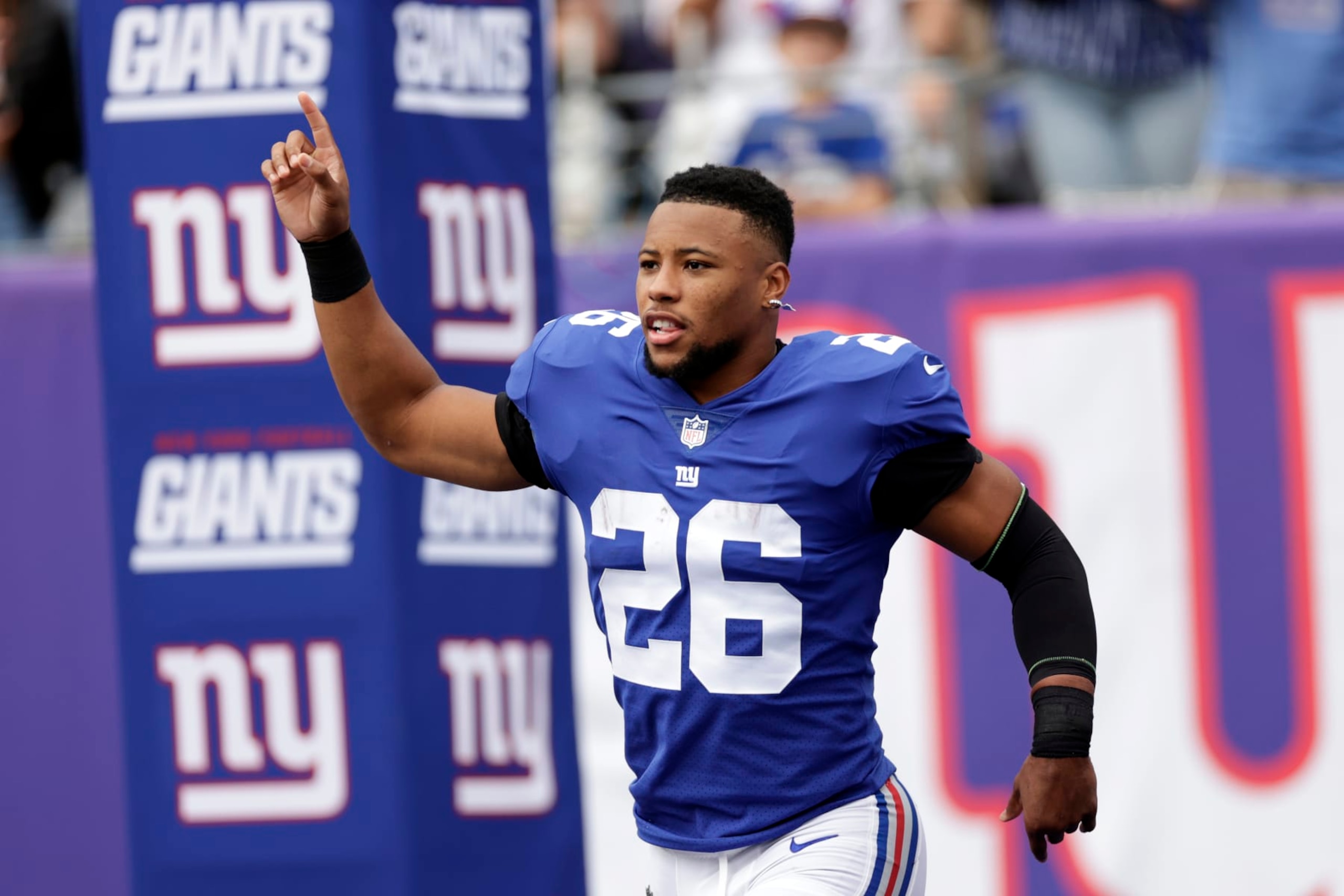 New York Giants running back Saquon Barkley (26) takes the field to face the Baltimore Ravens during an NFL football game Sunday, Oct. 16, 2022, in East Rutherford, N.J. (AP Photo/Adam Hunger)