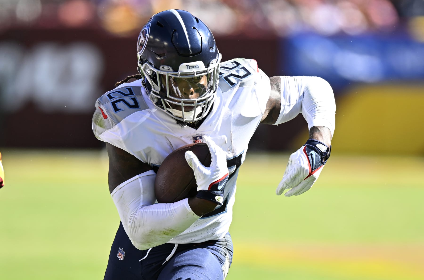 LANDOVER, MARYLAND - OCTOBER 09: Derrick Henry #22 of the Tennessee Titans rushes the ball against the Washington Commanders at FedExField on October 09, 2022 in Landover, Maryland. (Photo by G Fiume/Getty Images)