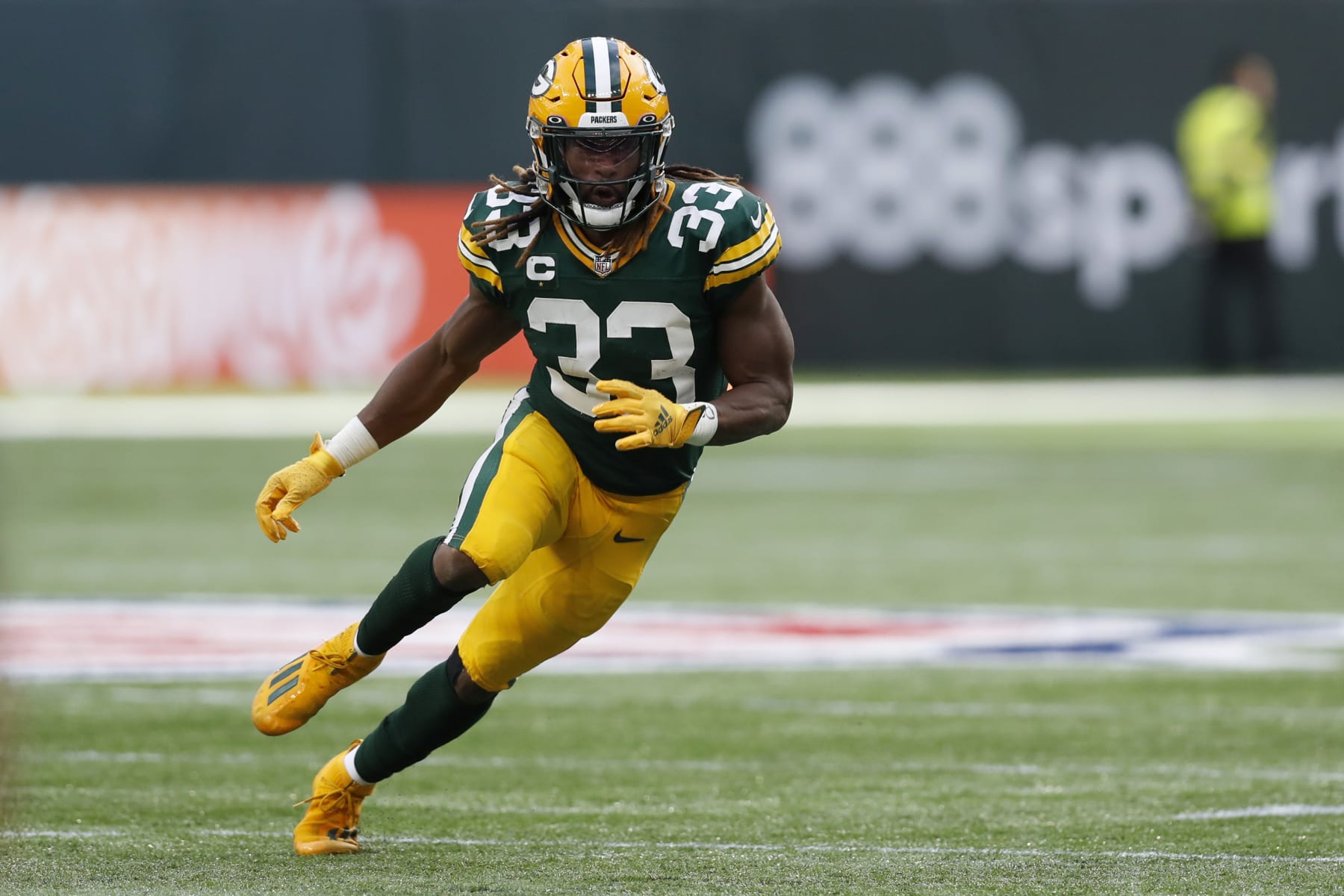Green Bay Packers running back Aaron Jones (33) in action during an NFL football game against the New York Giants at Tottenham Hotspur Stadium in London, Sunday, Oct. 9, 2022. (AP Photo/Steve Luciano)