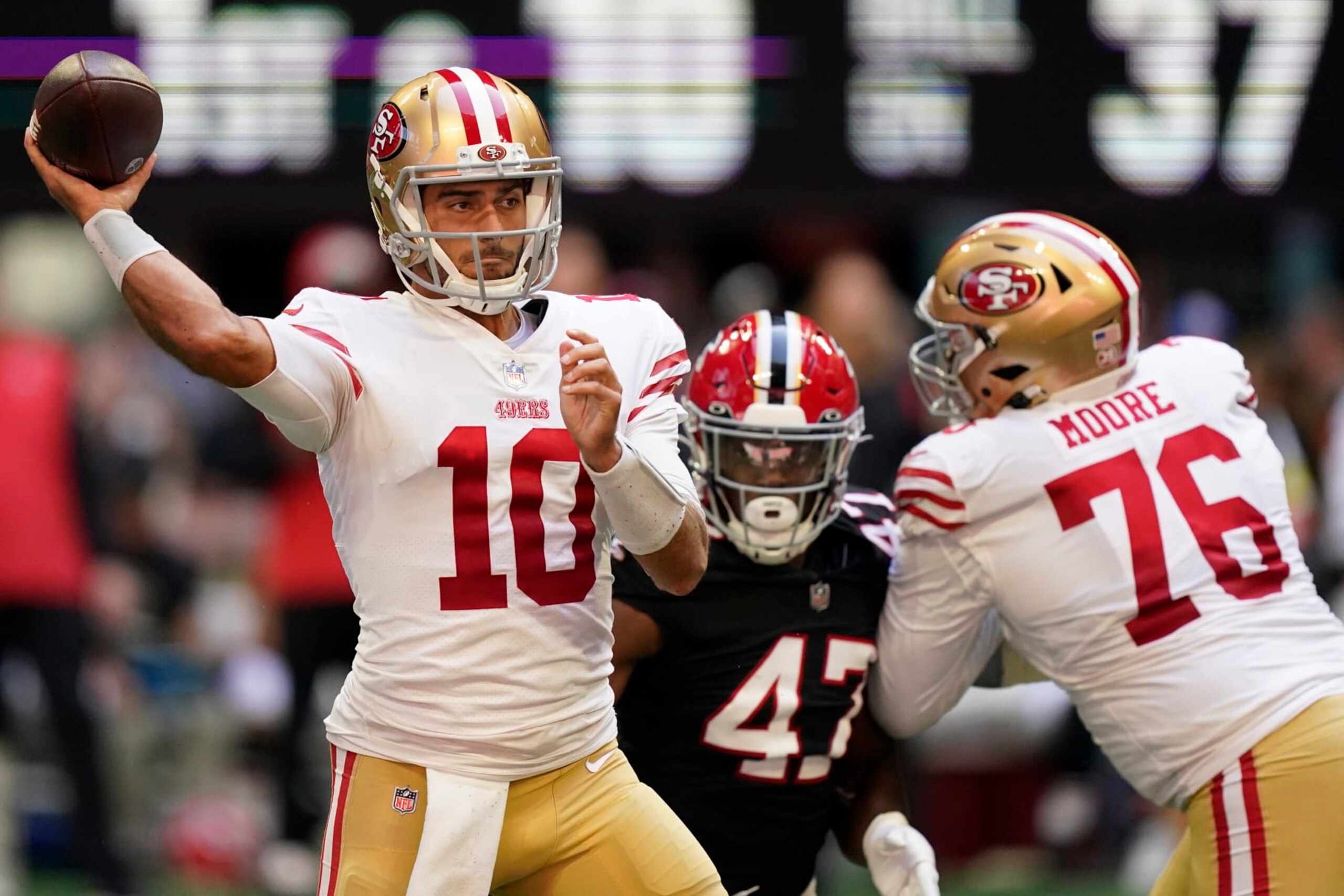 San Francisco 49ers quarterback Jimmy Garoppolo (10) works in the pocket against the Atlanta Falcons during the first half of an NFL football game, Sunday, Oct. 16, 2022, in Atlanta. (AP Photo/Brynn Anderson)