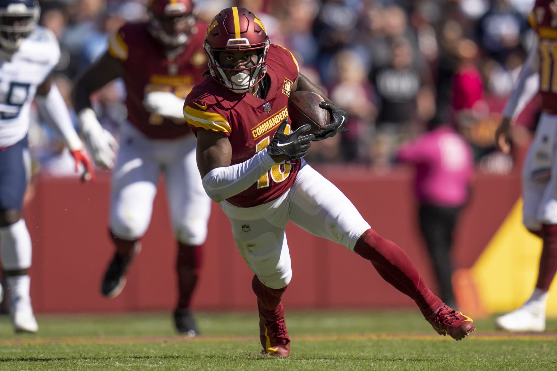 Washington Commanders wide receiver Curtis Samuel (10) runs with the ball during the first half of an NFL football game against the Tennessee Titans, Sunday, Oct. 9, 2022, in Landover, Md. The Titans won 21-17. (AP Photo/Jess Rapfogel)