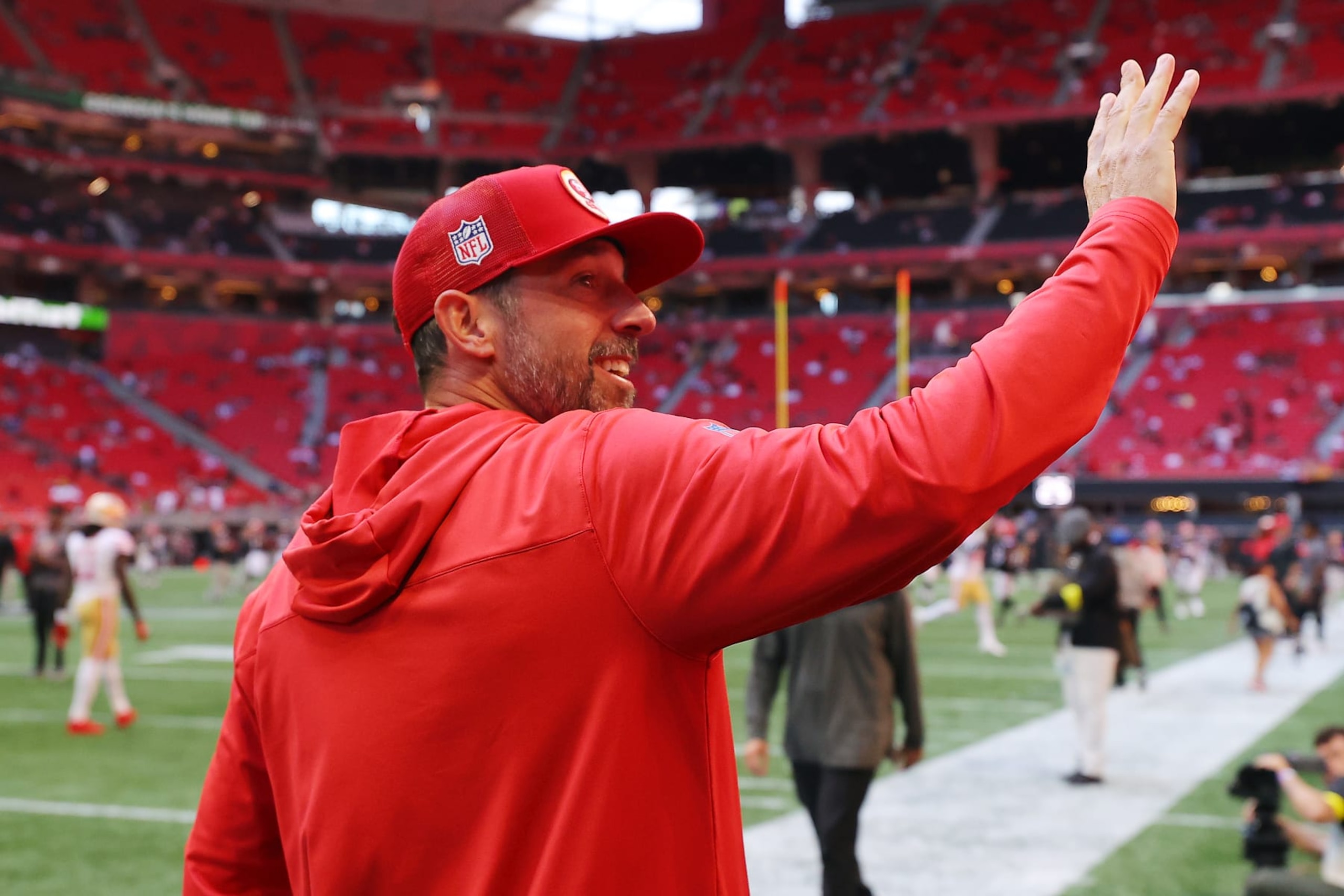 ATLANTA, GEORGIA - OCTOBER 16: Head coach Kyle Shanahan of the San Francisco 49ers waves to fans prior to a game against the Atlanta Falcons at Mercedes-Benz Stadium on October 16, 2022 in Atlanta, Georgia. (Photo by Kevin C. Cox/Getty Images)