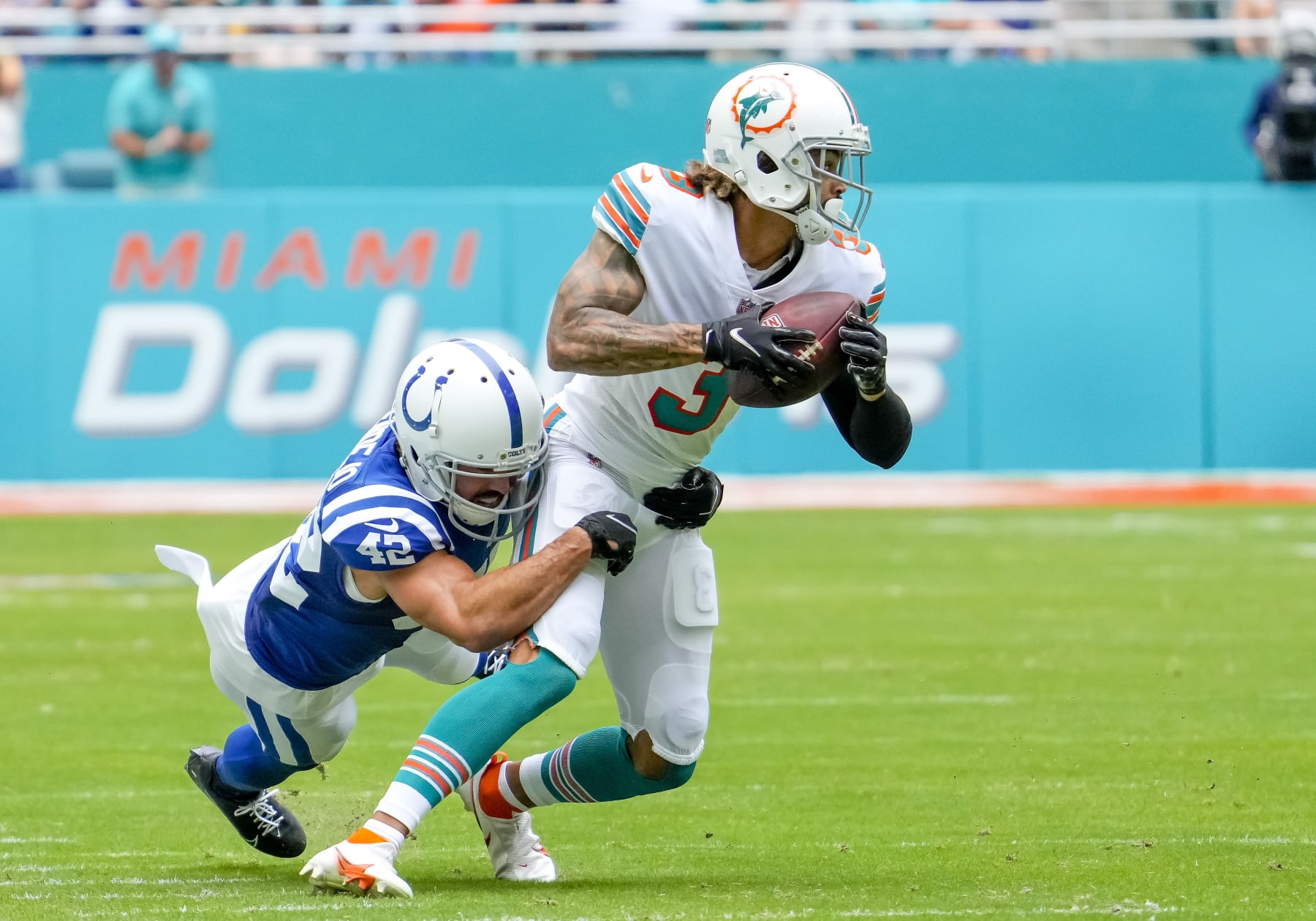 MIAMI GARDENS, FL - OCTOBER 03: Indianapolis Colts defensive back Rolan Milligan (42) tackles Miami Dolphins wide receiver Will Fuller (3) during the NFL Football match between the Miami Dolphins and Indianapolis  Colts on October 3rd, 2021 at Hard Rock Stadium in Miami, FL. (Photo by Andrew Bershaw/Icon Sportswire via Getty Images)