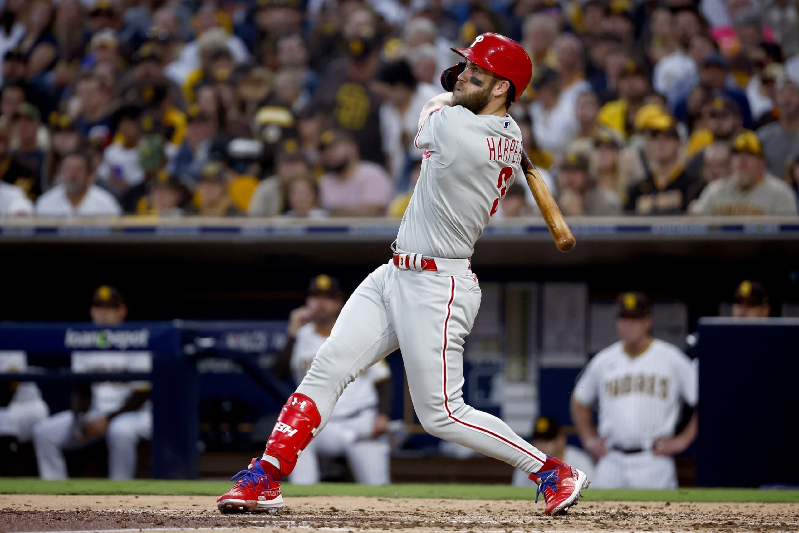 SAN DIEGO, CALIFORNIA - OCTOBER 18: Bryce Harper #3 of the Philadelphia Phillies hits a home run during the fourth inning against the San Diego Padres in game one of the National League Championship Series at PETCO Park on October 18, 2022 in San Diego, California. (Photo by Ronald Martinez/Getty Images)