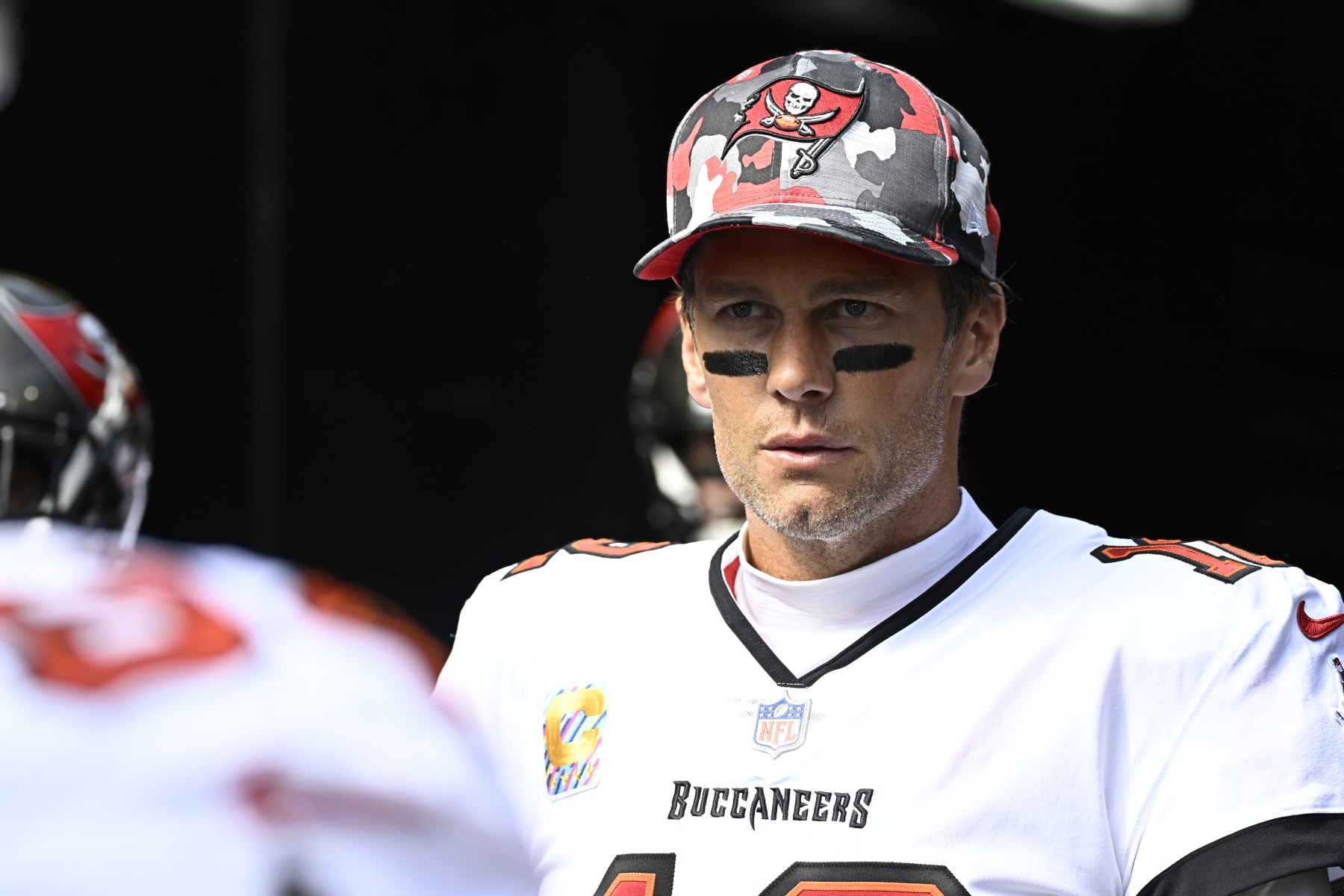 PITTSBURGH, PA - OCTOBER 16:   Tampa Bay Buccaneers quarterback Tom Brady (12) looks on to the field as he enters from the tunnel during the game between the Tampa Bay Buccaneers and the Pittsburgh Steelers at Acrisure Stadium in Pittsburgh, PA on October 16, 2022.  (Photo by Shelley Lipton/Icon Sportswire via Getty Images)