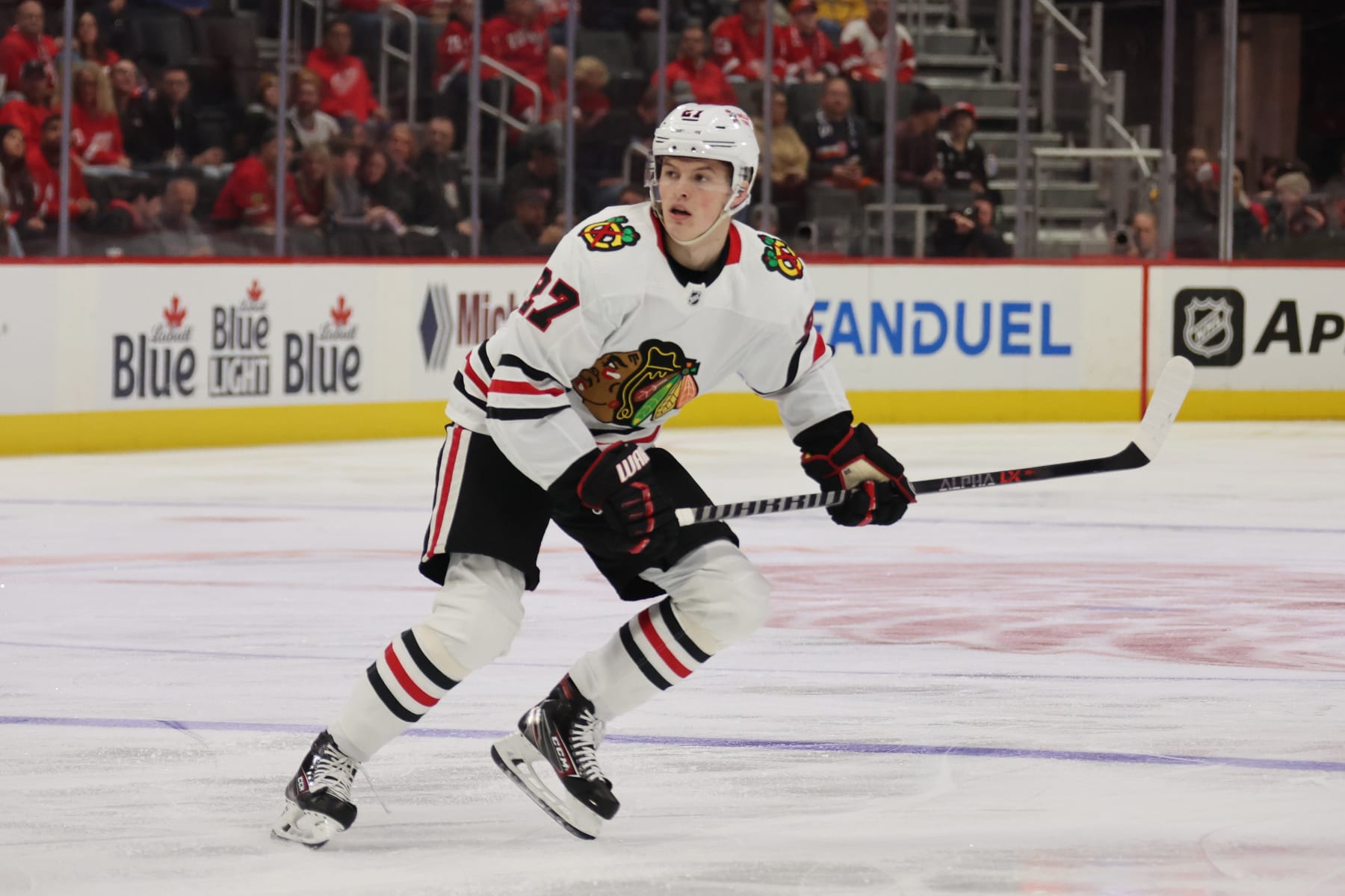 DETROIT, MICHIGAN - SEPTEMBER 28: Lukas Reichel #27 of the Chicago Blackhawks skates against the Detroit Red Wings at Little Caesars Arena on September 28, 2022 in Detroit, Michigan. (Photo by Gregory Shamus/Getty Images)