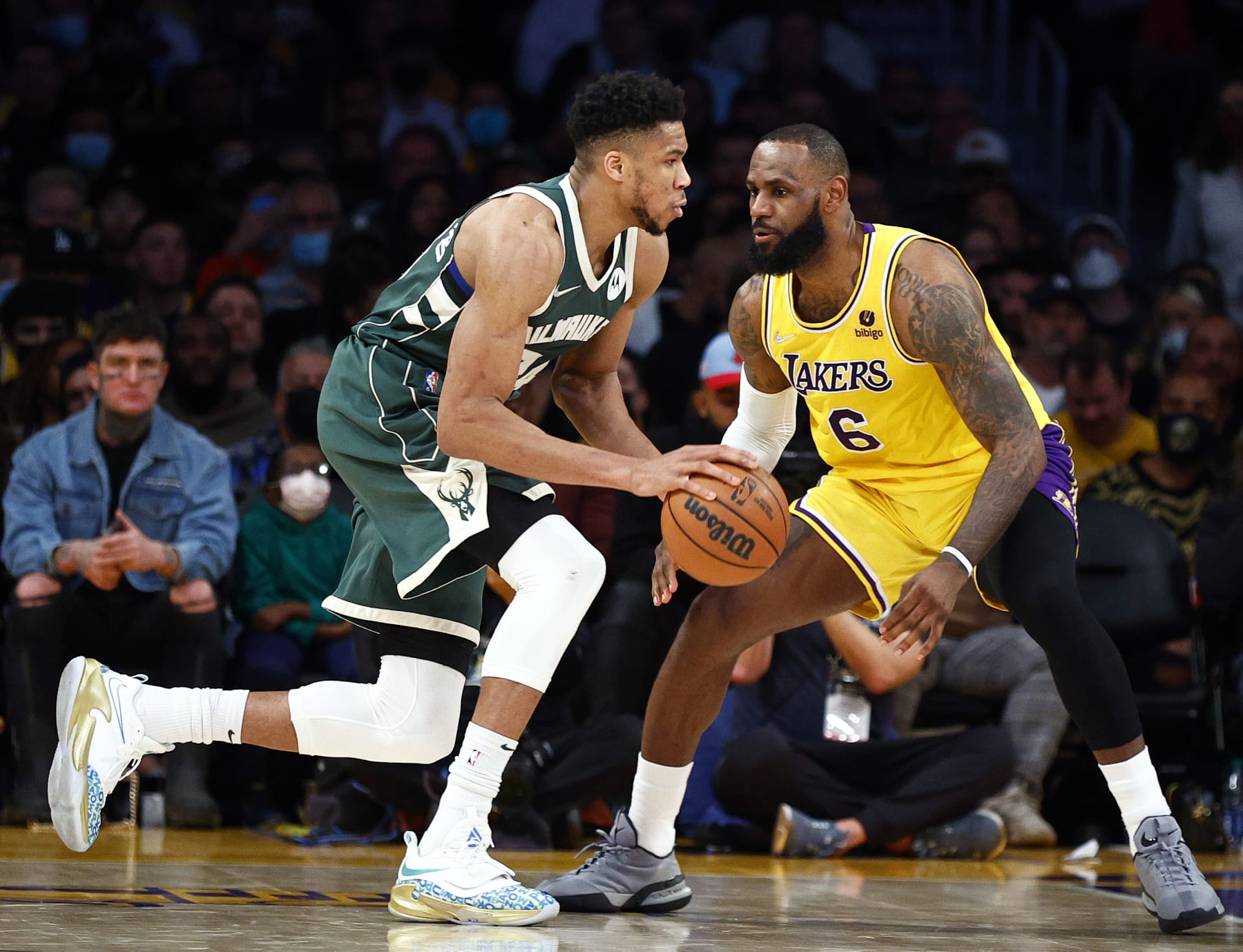 LOS ANGELES, CALIFORNIA - FEBRUARY 08:  Giannis Antetokounmpo #34 of the Milwaukee Bucks dribbles the ball against LeBron James #6 of the Los Angeles Lakers in the second quarter at Crypto.com Arena on February 08, 2022 in Los Angeles, California.  NOTE TO USER: User expressly acknowledges and agrees that, by downloading and/or using this Photograph, user is consenting to the terms and conditions of the Getty Images License Agreement.  (Photo by Ronald Martinez/Getty Images)