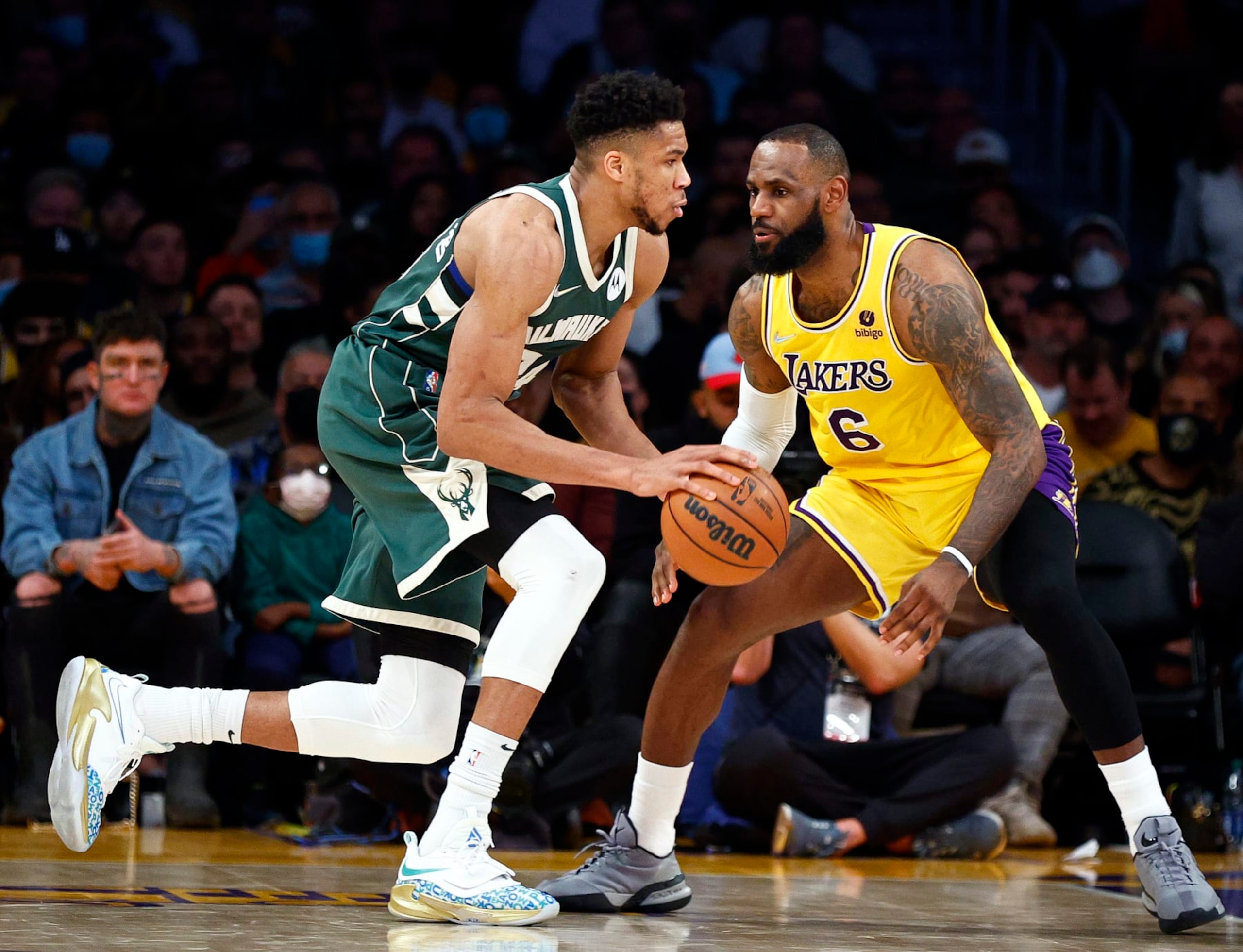 LOS ANGELES, CALIFORNIA - FEBRUARY 08:  Giannis Antetokounmpo #34 of the Milwaukee Bucks dribbles the ball against LeBron James #6 of the Los Angeles Lakers in the second quarter at Crypto.com Arena on February 08, 2022 in Los Angeles, California.  NOTE TO USER: User expressly acknowledges and agrees that, by downloading and/or using this Photograph, user is consenting to the terms and conditions of the Getty Images License Agreement.  (Photo by Ronald Martinez/Getty Images)