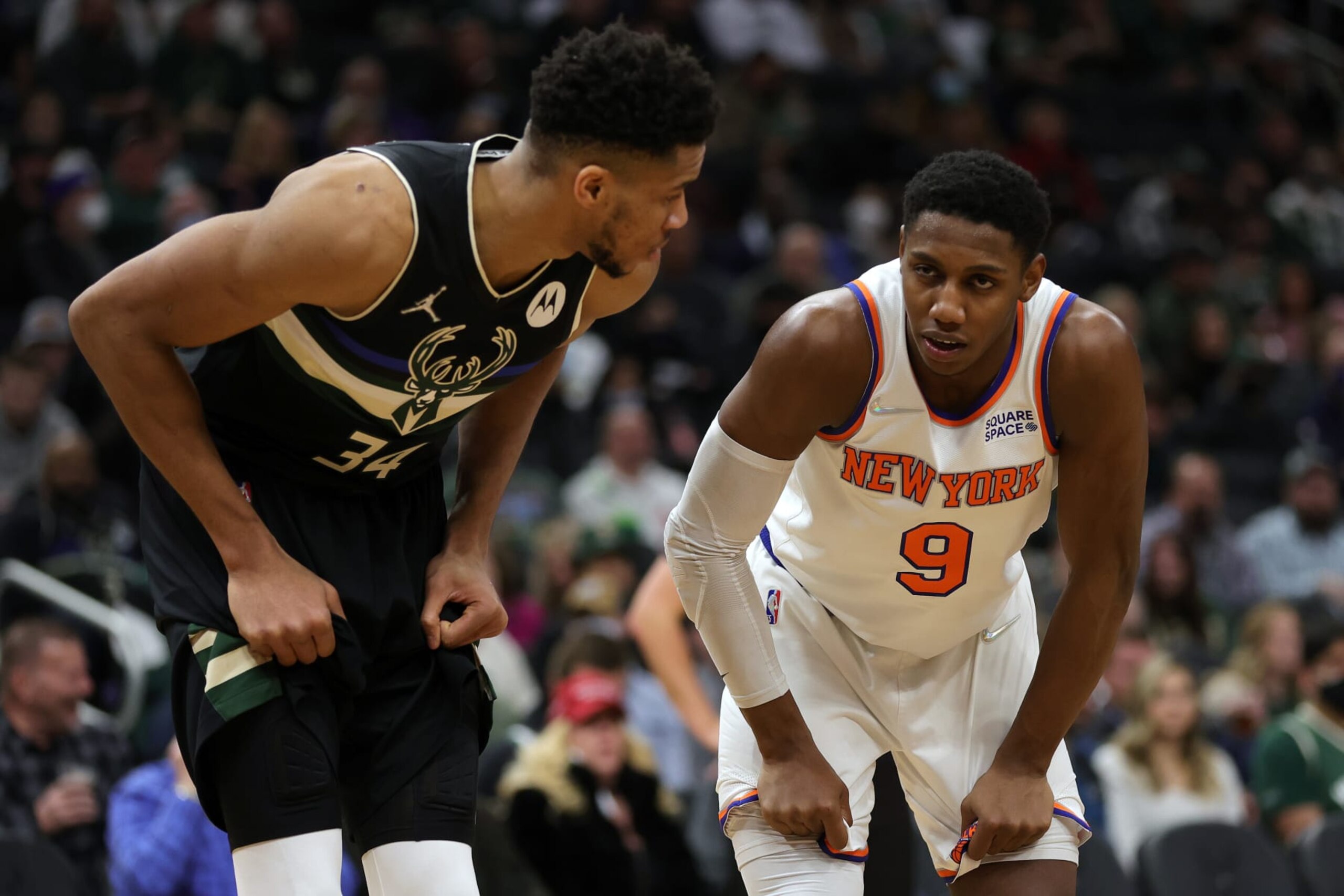 MILWAUKEE, WISCONSIN - JANUARY 28: Giannis Antetokounmpo #34 of the Milwaukee Bucks and RJ Barrett #9 of the New York Knicks talk during a free throw attempt in the third quarter at Fiserv Forum on January 28, 2022 in Milwaukee, Wisconsin. NOTE TO USER: User expressly acknowledges and agrees that, by downloading and or using this photograph, User is consenting to the terms and conditions of the Getty Images License Agreement. (Photo by Stacy Revere/Getty Images)