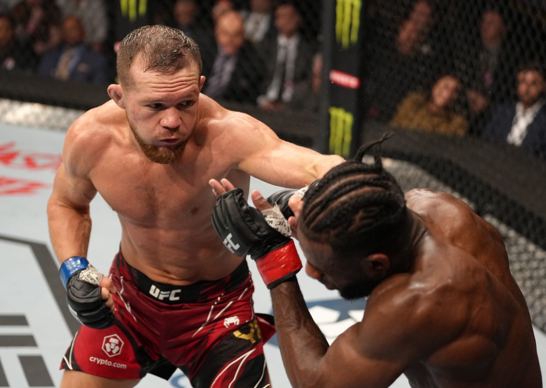JACKSONVILLE, FLORIDA - APRIL 09: (L-R) Petr Yan of Russia punches Aljamain Sterling in their UFC bantamweight championship fight during the UFC 273 event at VyStar Veterans Memorial Arena on April 09, 2022 in Jacksonville, Florida. (Photo by Jeff Bottari/Zuffa LLC)