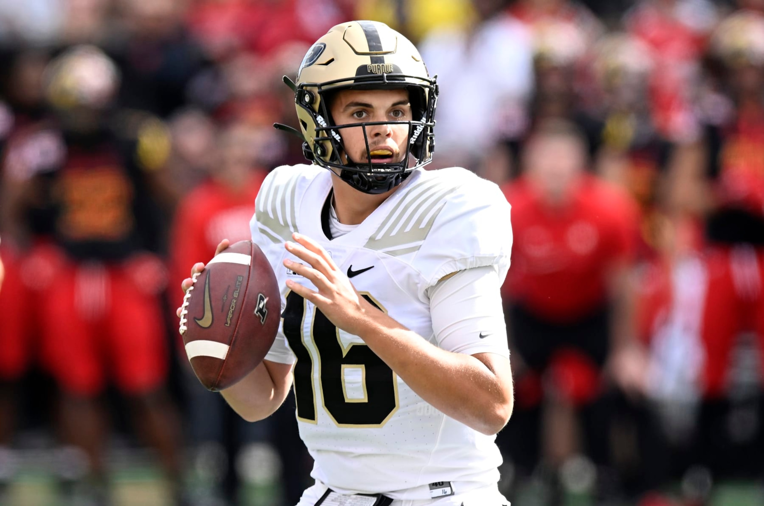 COLLEGE PARK, MARYLAND - OCTOBER 08: Aidan O'Connell #16 of the Purdue Boilermakers drops back to pass against the Maryland Terrapins at SECU Stadium on October 08, 2022 in College Park, Maryland. (Photo by G Fiume/Getty Images)