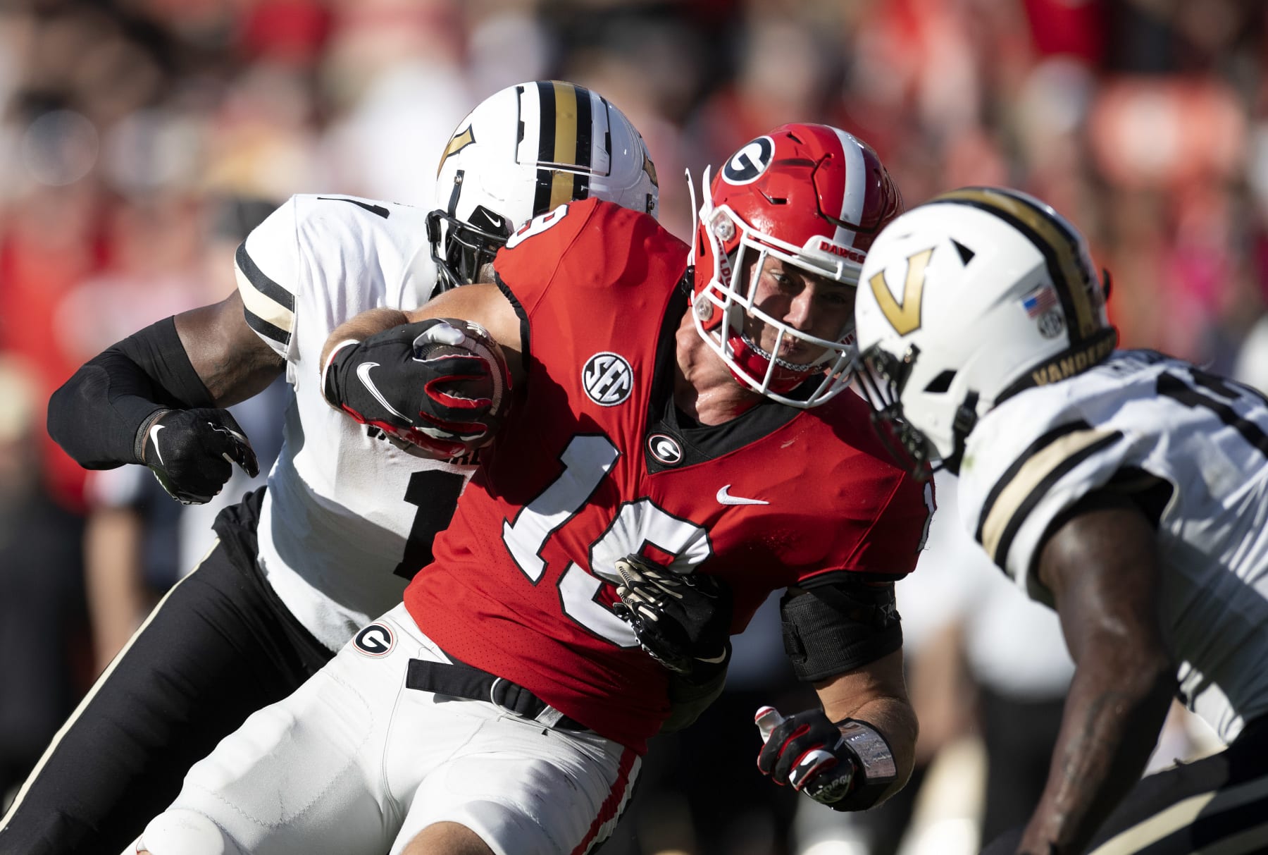 ATHENS, GA - OCTOBER 15: Brock Bowers #19 of the Georgia Bulldogs is tackled by Elijah McAllister #1 and CJ Taylor #13 of the Vanderbilt Commodores during the second quarter at Sanford Stadium on October 15, 2022 in Athens, Georgia. (Photo by Adam Hagy/Getty Images)