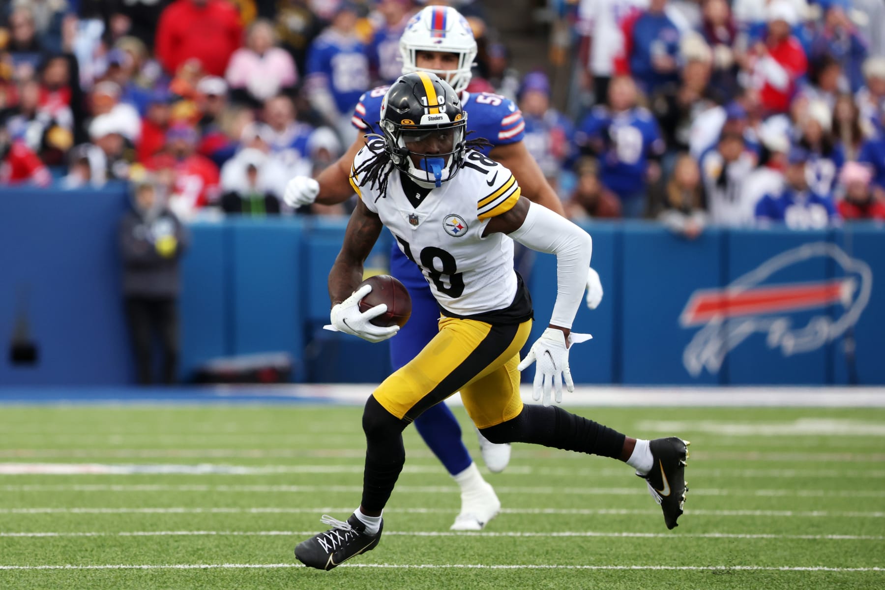 ORCHARD PARK, NEW YORK - OCTOBER 09: Diontae Johnson #18 of the Pittsburgh Steelers runs against the Buffalo Bills at Highmark Stadium on October 09, 2022 in Orchard Park, New York. (Photo by Timothy T Ludwig/Getty Images)
