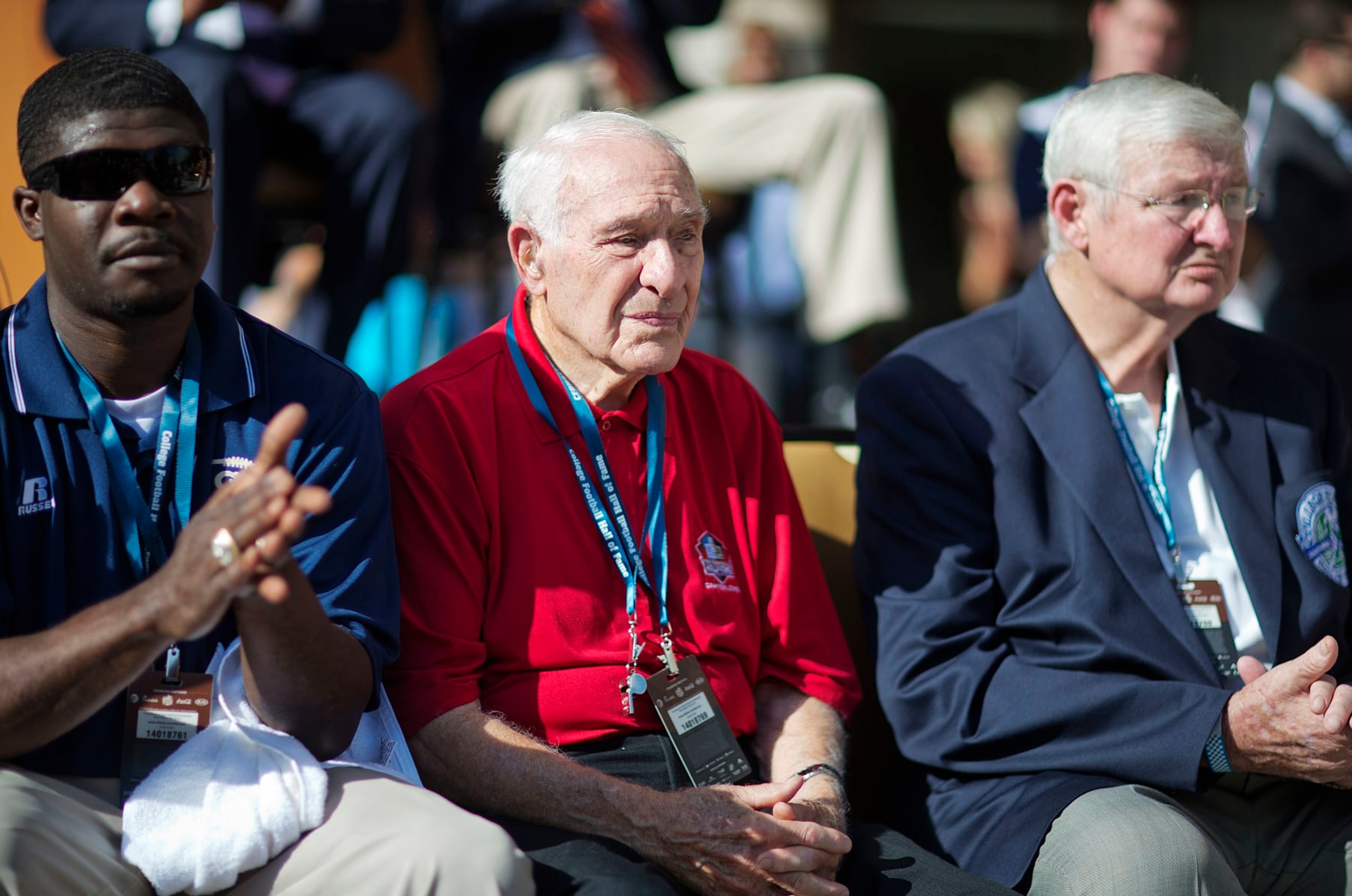 Former University of Georgia player Charley Trippi, center, is introduced at the grand opening ceremony for the new College Football Hall of Fame, Saturday, Aug. 23, 2014, in Atlanta. The new high-tech hall features an interactive experience that begins when the guest registers for a smart pass, selects a favorite school and then sees that school's helmet illuminated. (AP Photo/David Goldman) Former University of Georgia player Charley Trippi, center, is introduced at the grand opening ceremony for the new College Football Hall of Fame, Saturday, Aug. 23, 2014, in Atlanta. The new high-tech hall features an interactive experience that begins when the guest registers for a smart pass, selects a favorite school and then sees that school's helmet illuminated. (AP Photo/David Goldman)