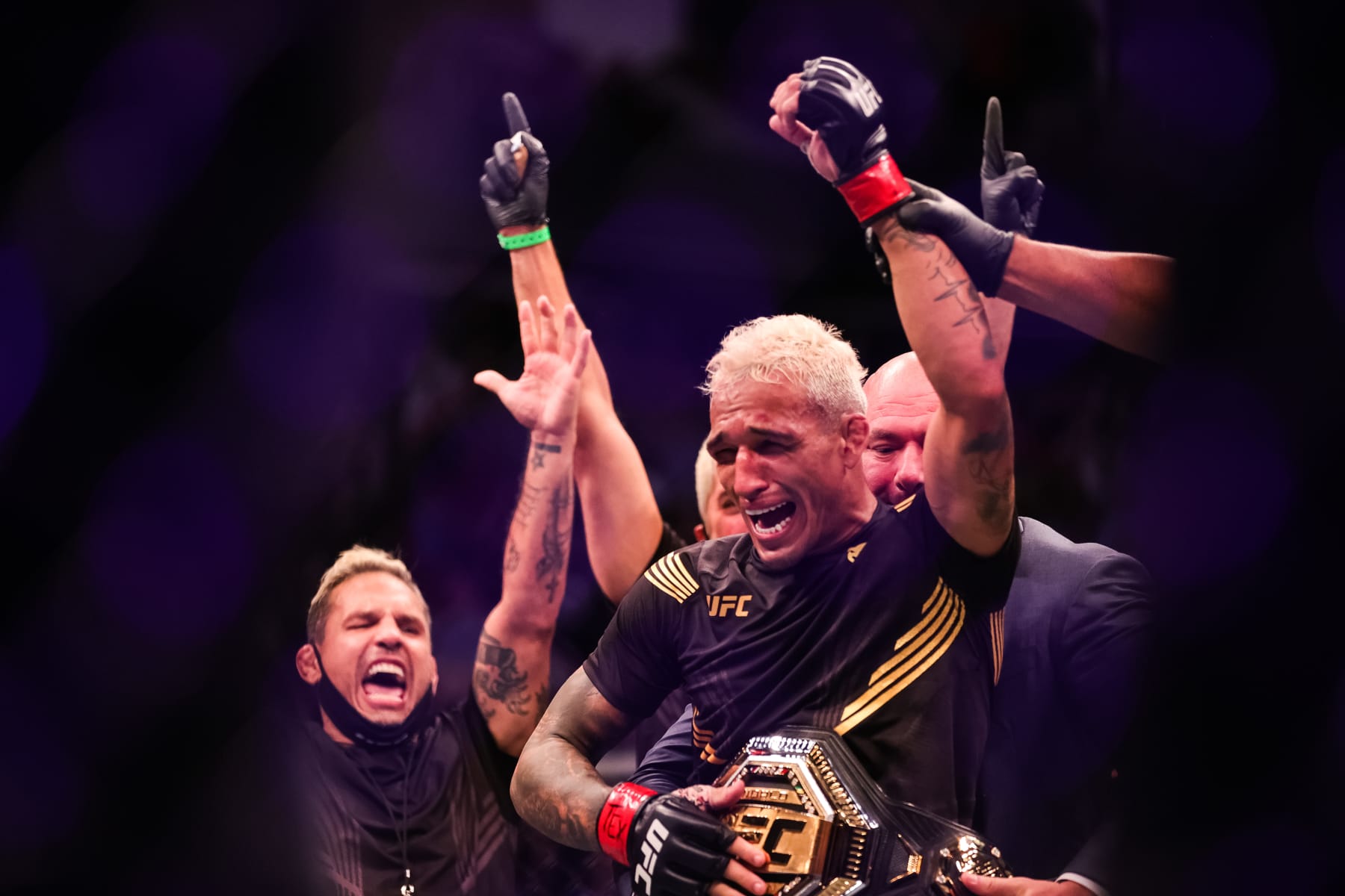 HOUSTON, TEXAS - MAY 15: Dana White places the belt on Charles Oliveira after he defeated Michael Chandler during their Championship Lightweight Bout of UFC 262 at Toyota Center on May 15, 2021 in Houston, Texas. (Photo by Carmen Mandato/Getty Images)