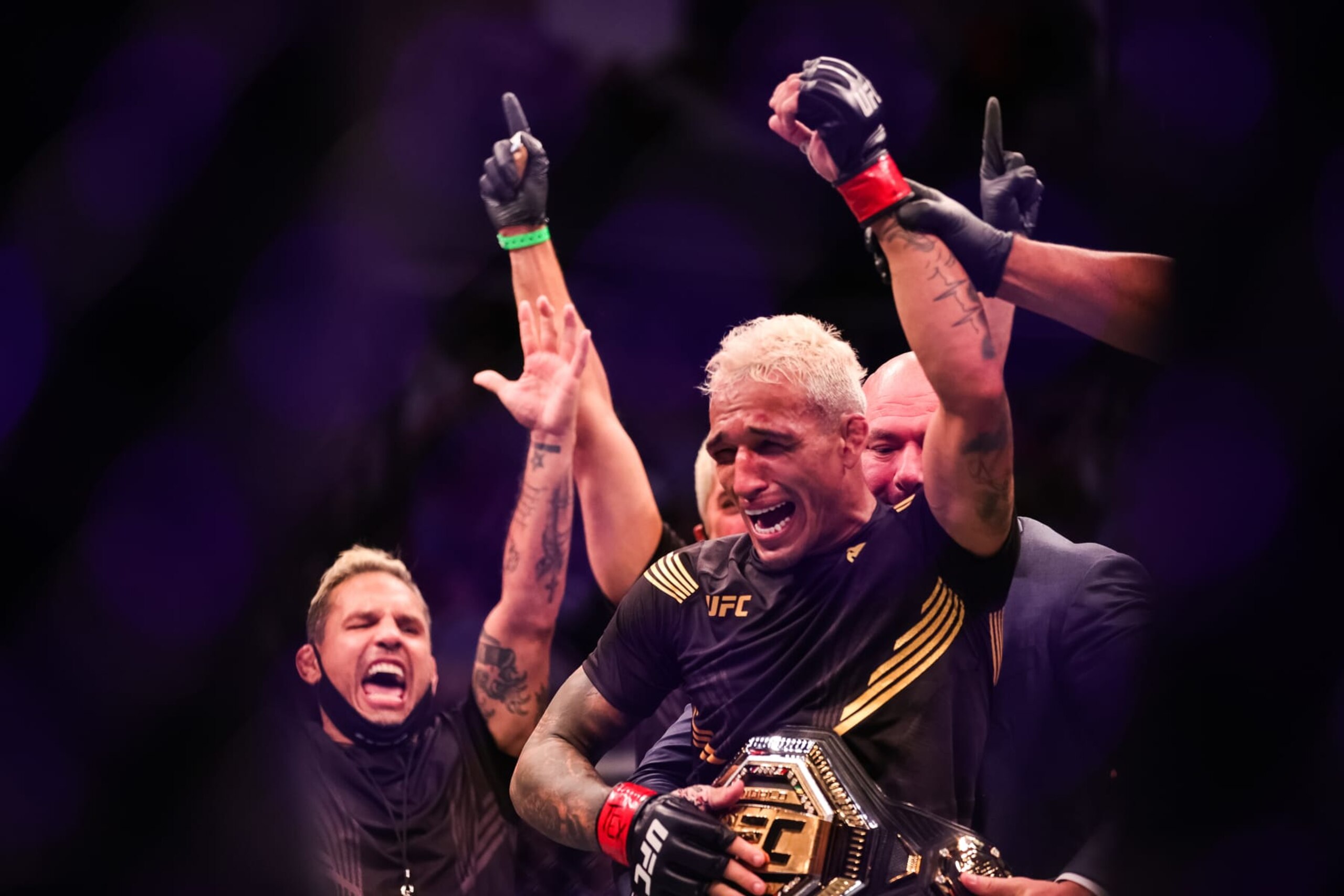 HOUSTON, TEXAS - MAY 15: Dana White places the belt on Charles Oliveira after he defeated Michael Chandler during their Championship Lightweight Bout of UFC 262 at Toyota Center on May 15, 2021 in Houston, Texas. (Photo by Carmen Mandato/Getty Images)
