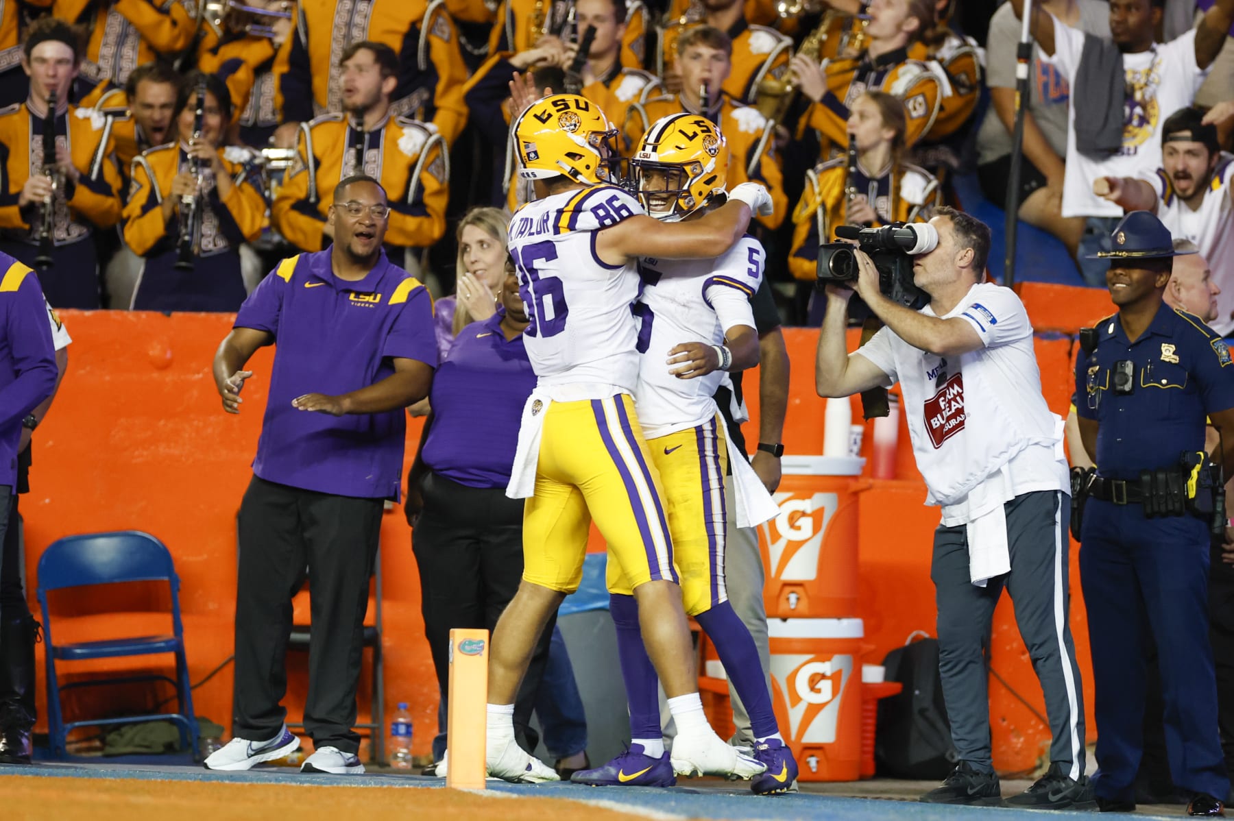GAINESVILLE, FL - OCTOBER 15: LSU Tigers tight end Mason Taylor (86) and LSU Tigers quarterback Jayden Daniels (5) celebrate a touchdown during the game between the LSU Tigers and the Florida Gators on October 15, 2022 at Ben Hill Griffin Stadium at Florida Field in Gainesville, Fl. (Photo by David Rosenblum/Icon Sportswire via Getty Images)