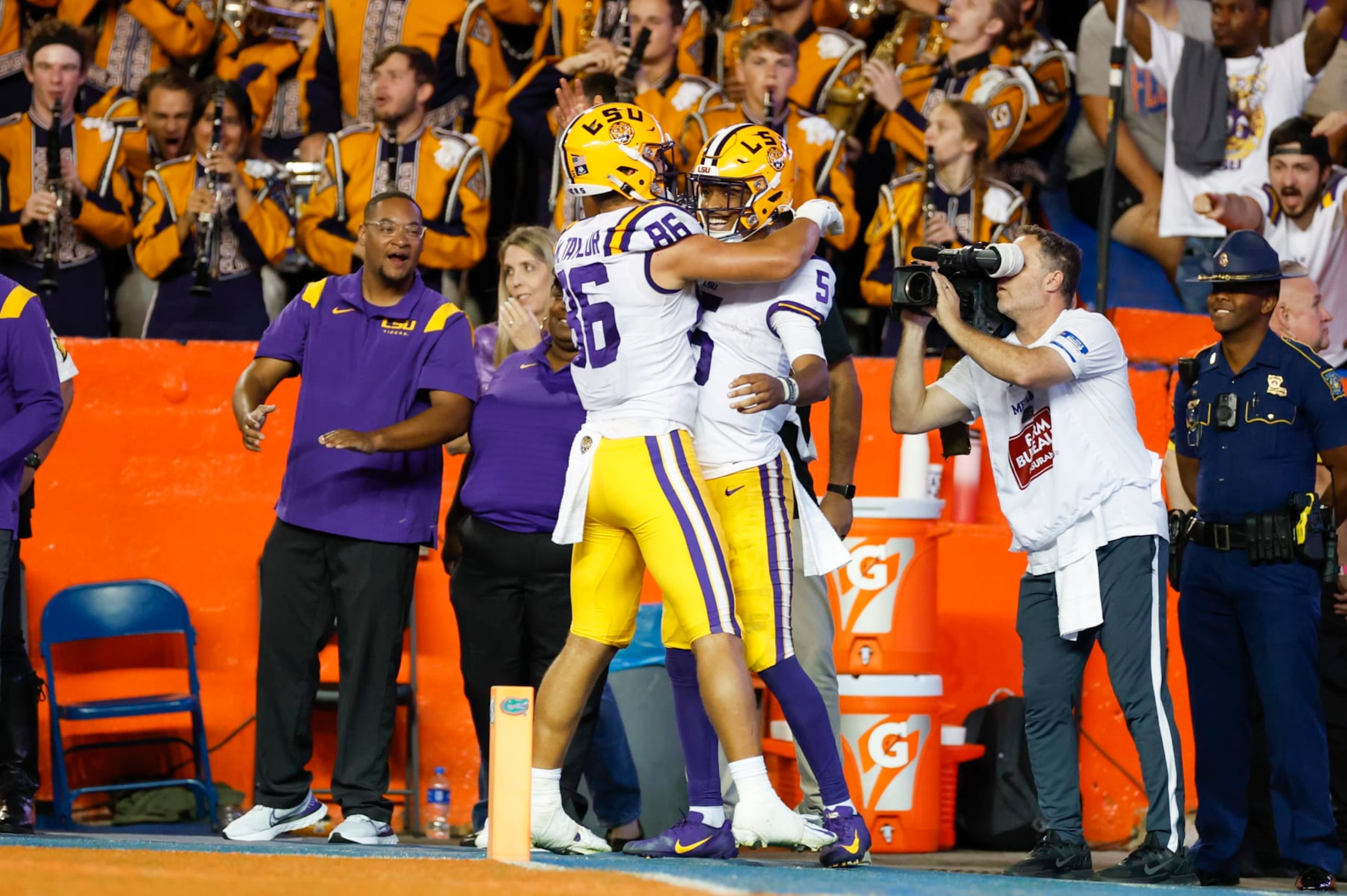 GAINESVILLE, FL - OCTOBER 15: LSU Tigers tight end Mason Taylor (86) and LSU Tigers quarterback Jayden Daniels (5) celebrate a touchdown during the game between the LSU Tigers and the Florida Gators on October 15, 2022 at Ben Hill Griffin Stadium at Florida Field in Gainesville, Fl. (Photo by David Rosenblum/Icon Sportswire via Getty Images)