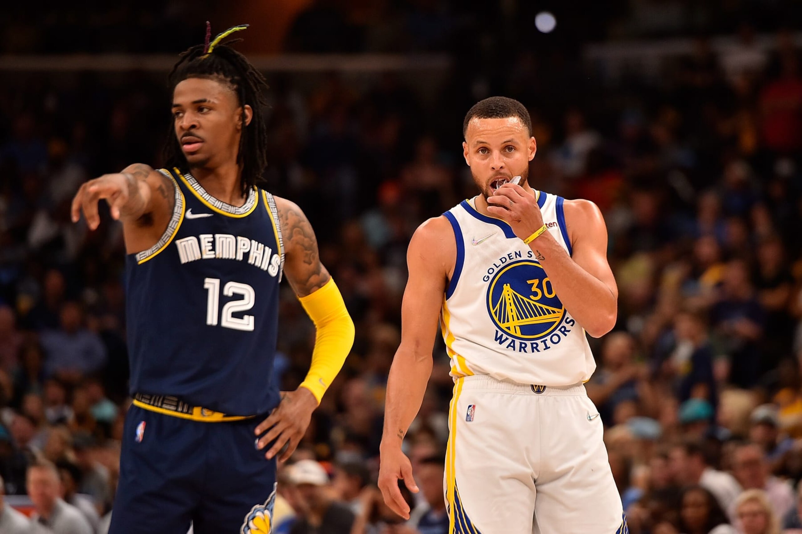 MEMPHIS, TENNESSEE - MAY 03: Ja Morant #12 of the Memphis Grizzlies and Stephen Curry #30 of the Golden State Warriors during Game Two of the Western Conference Semifinals of the NBA Playoffs at FedExForum on May 03, 2022 in Memphis, Tennessee. NOTE TO USER: User expressly acknowledges and agrees that, by downloading and or using this photograph, User is consenting to the terms and conditions of the Getty Images License Agreement. (Photo by Justin Ford/Getty Images)