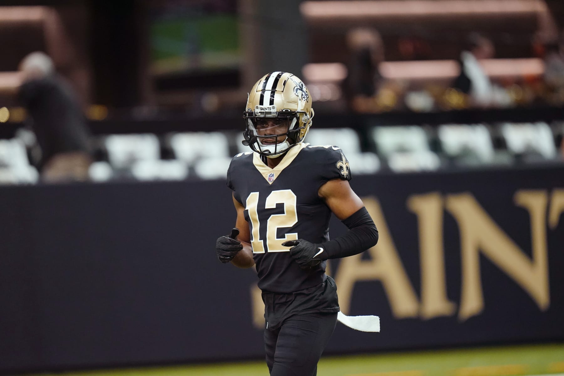 New Orleans Saints wide receiver Chris Olave (12) warms up before an NFL football game against the Tampa Bay Buccaneers in New Orleans, Sunday, Sept. 18, 2022. (AP Photo/Gerald Herbert)