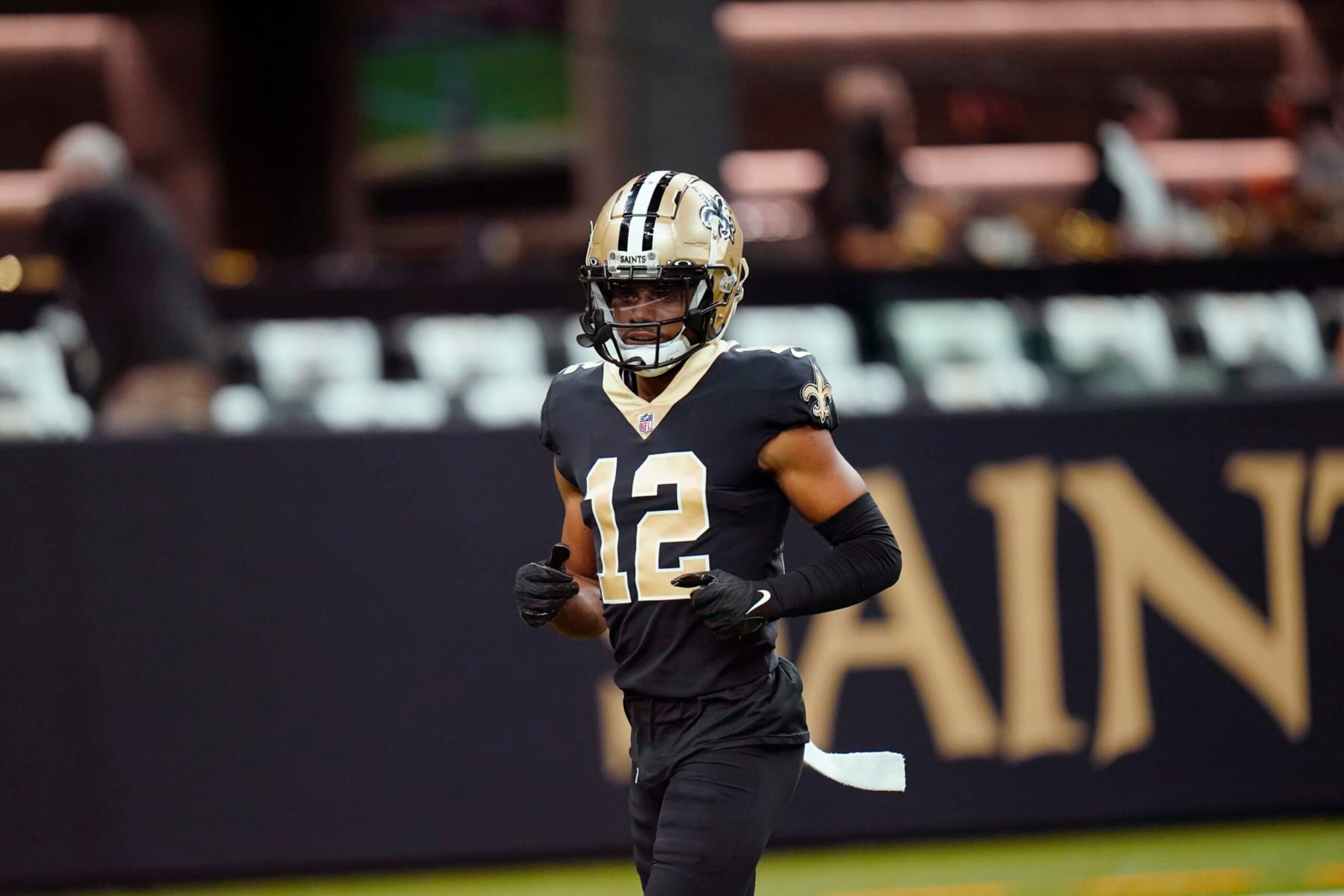 New Orleans Saints wide receiver Chris Olave (12) warms up before an NFL football game against the Tampa Bay Buccaneers in New Orleans, Sunday, Sept. 18, 2022. (AP Photo/Gerald Herbert)