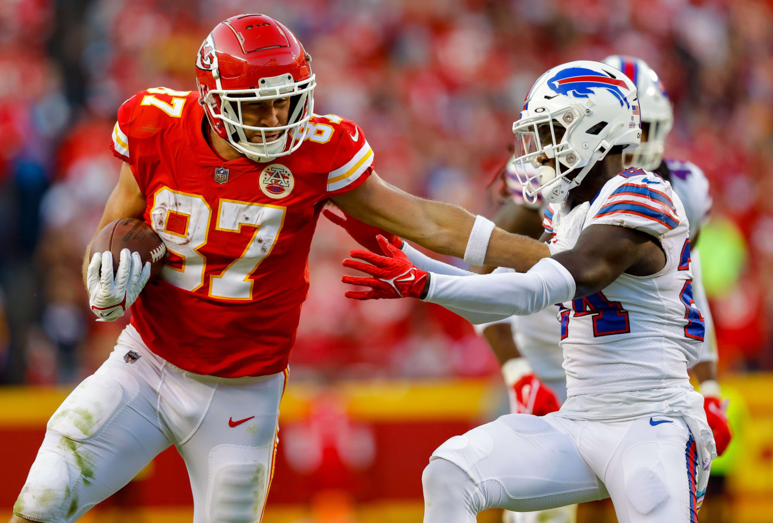 KANSAS CITY, MO - OCTOBER 16: Travis Kelce #87 of the Kansas City Chiefs pushes away Kaiir Elam #24 of the Buffalo Bills during the fourth quarter at Arrowhead Stadium on October 16, 2022 in Kansas City, Missouri. (Photo by David Eulitt/Getty Images)