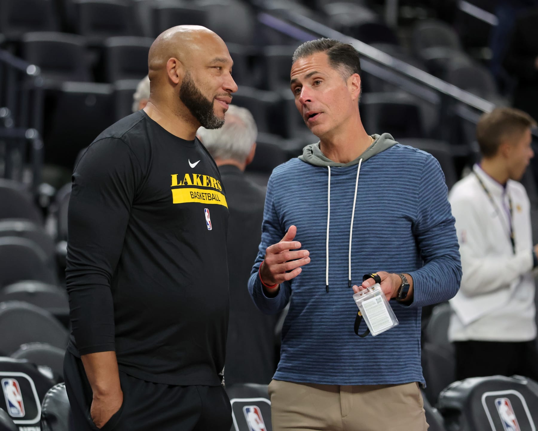 LAS VEGAS, NEVADA - OCTOBER 06: Head coach Darvin Ham (L) and vice president of basketball operations and general manager Rob Pelinka of the Los Angeles Lakers talk before a preseason game against the Minnesota Timberwolves at T-Mobile Arena on October 06, 2022 in Las Vegas, Nevada. The Timberwolves defeated the Lakers 114-99. NOTE TO USER: User expressly acknowledges and agrees that, by downloading and or using this photograph, User is consenting to the terms and conditions of the Getty Images License Agreement. (Photo by Ethan Miller/Getty Images)