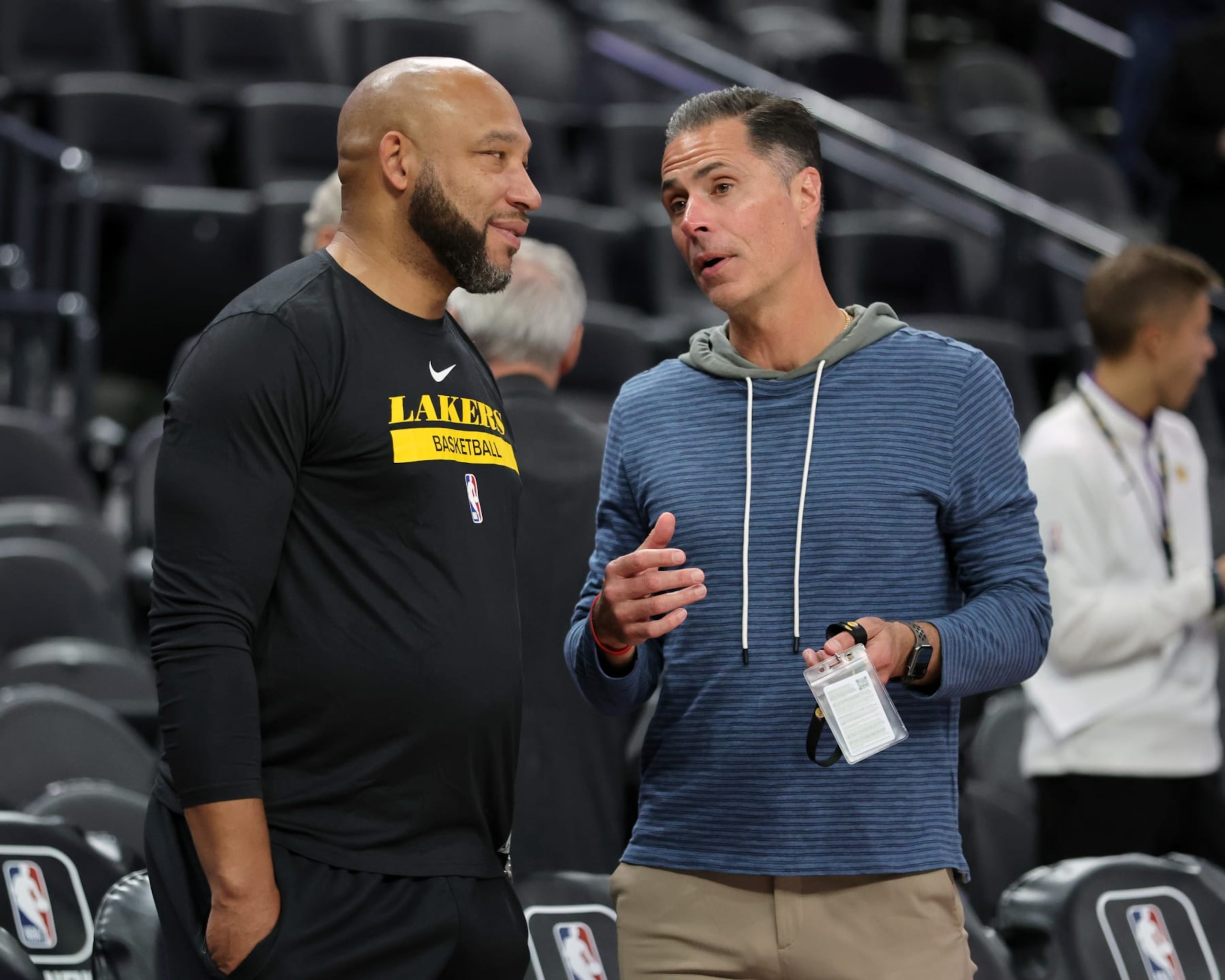 LAS VEGAS, NEVADA - OCTOBER 06: Head coach Darvin Ham (L) and vice president of basketball operations and general manager Rob Pelinka of the Los Angeles Lakers talk before a preseason game against the Minnesota Timberwolves at T-Mobile Arena on October 06, 2022 in Las Vegas, Nevada. The Timberwolves defeated the Lakers 114-99. NOTE TO USER: User expressly acknowledges and agrees that, by downloading and or using this photograph, User is consenting to the terms and conditions of the Getty Images License Agreement. (Photo by Ethan Miller/Getty Images)