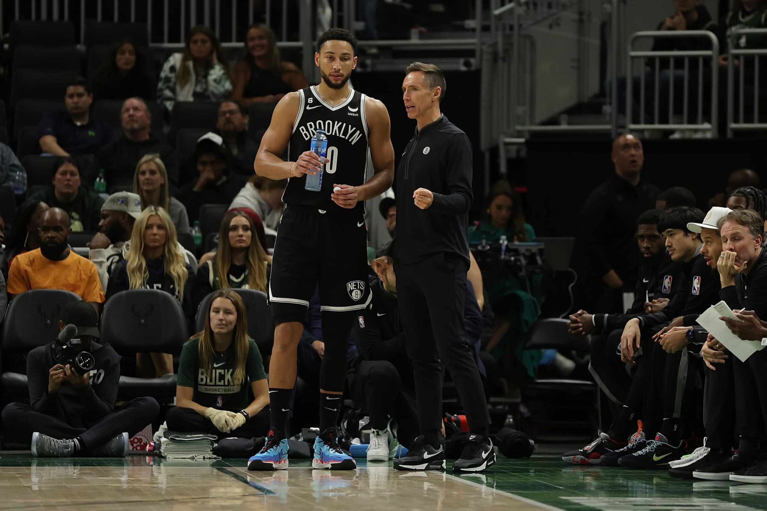 MILWAUKEE, WISCONSIN - OCTOBER 12: Ben Simmons #10 of the Brooklyn Nets speaks with head coach Steve Nash during a preseason game against the Milwaukee Bucks at Fiserv Forum on October 12, 2022 in Milwaukee, Wisconsin. NOTE TO USER: User expressly acknowledges and agrees that, by downloading and or using this photograph, User is consenting to the terms and conditions of the Getty Images License Agreement. (Photo by Stacy Revere/Getty Images)