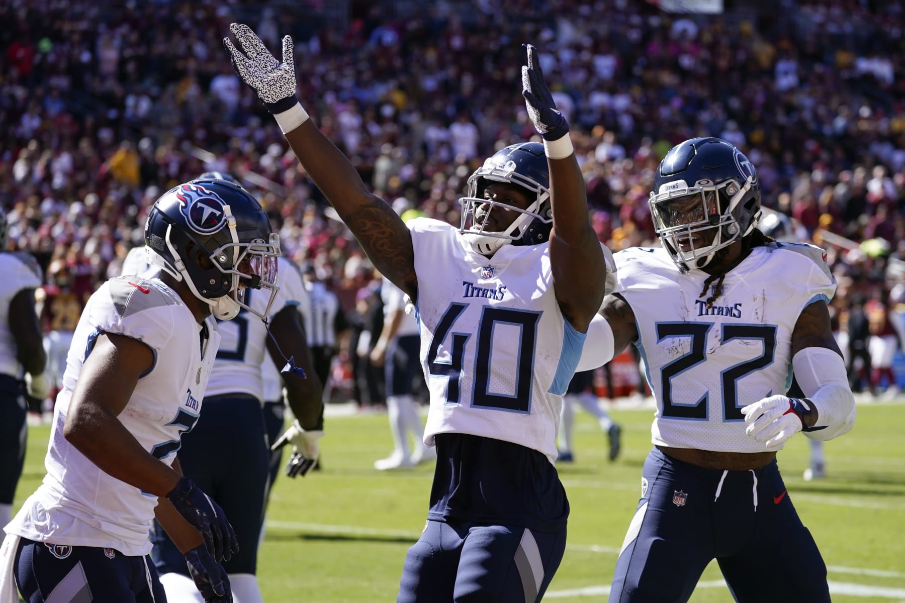 Tennessee Titans running back Dontrell Hilliard (40) celebrates his touchdown with teammates in the first half of an NFL football game against the Washington Commanders, Sunday, Oct. 9, 2022, in Landover, Md. (AP Photo/Alex Brandon)