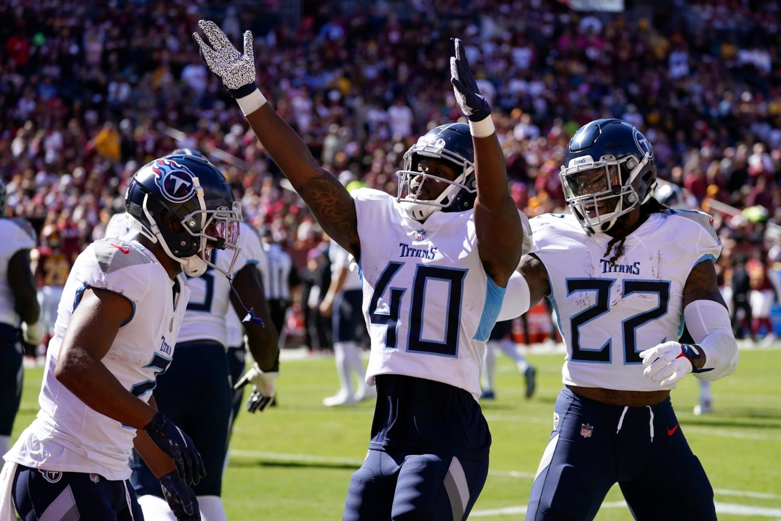 Tennessee Titans running back Dontrell Hilliard (40) celebrates his touchdown with teammates in the first half of an NFL football game against the Washington Commanders, Sunday, Oct. 9, 2022, in Landover, Md. (AP Photo/Alex Brandon) Tennessee Titans running back Dontrell Hilliard (40) celebrates his touchdown with teammates in the first half of an NFL football game against the Washington Commanders, Sunday, Oct. 9, 2022, in Landover, Md. (AP Photo/Alex Brandon)