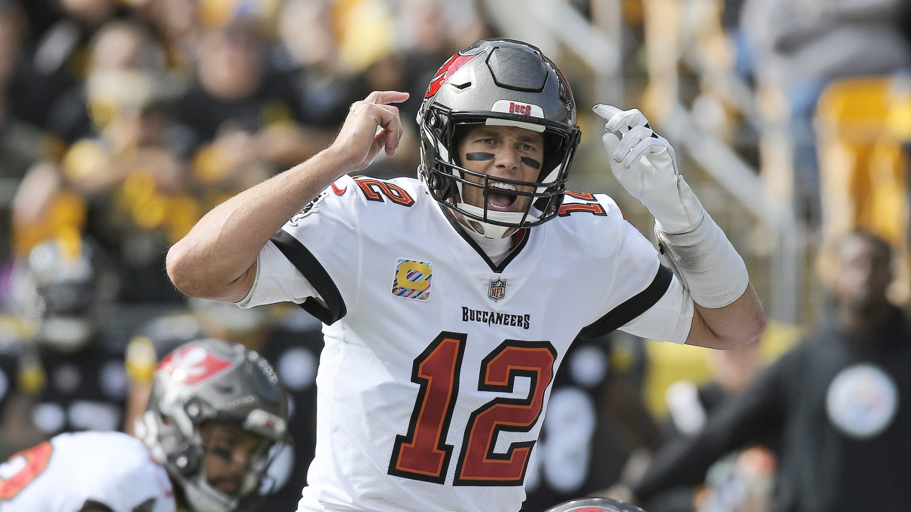 Tampa Bay Buccaneers quarterback Tom Brady (12) gives signals at the line of scrimmage during the first half of an NFL football game against the Pittsburgh Steelers in Pittsburgh, Sunday, Oct. 16, 2022. (AP Photo/Don Wright)