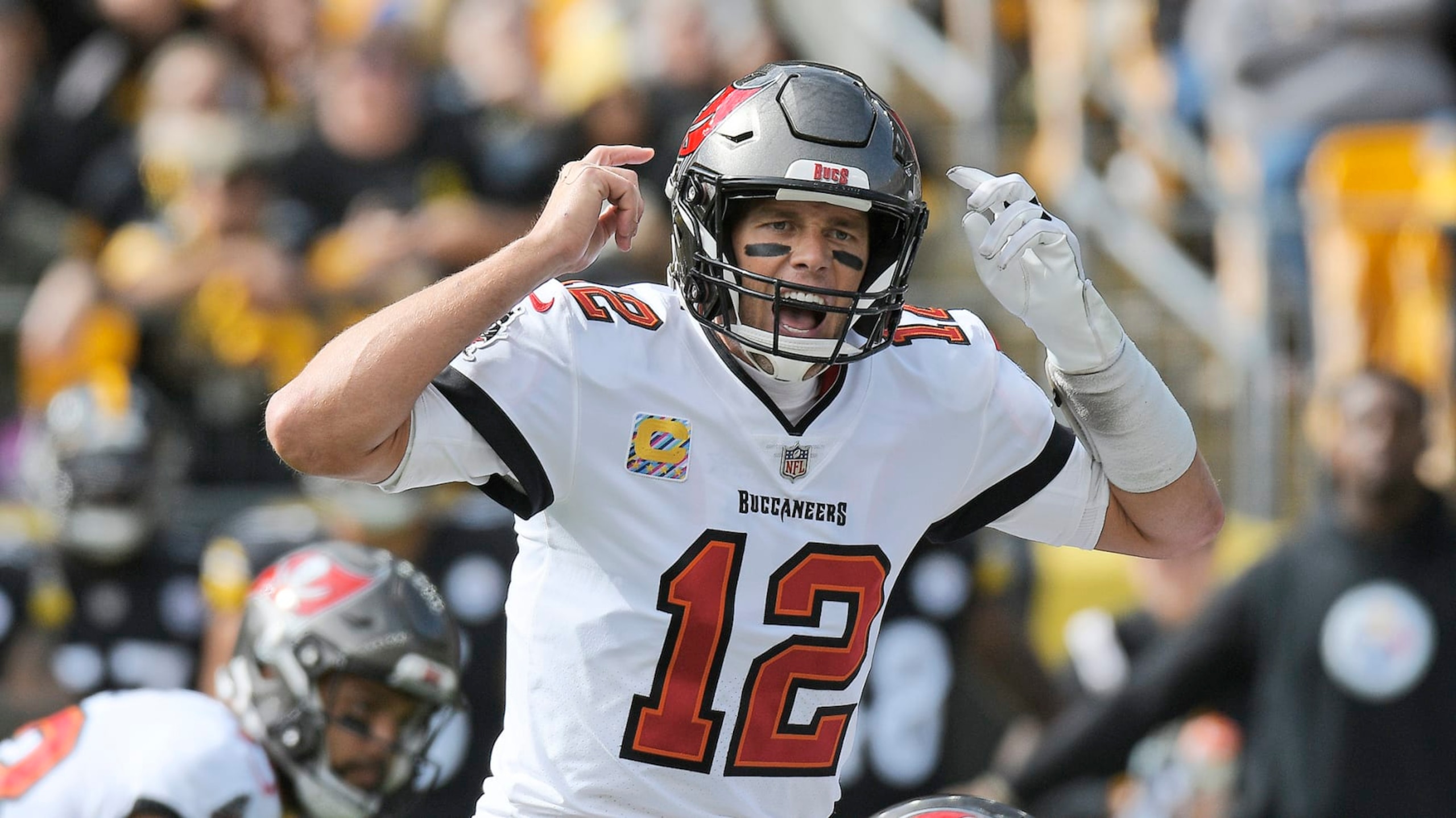 Tampa Bay Buccaneers quarterback Tom Brady (12) gives signals at the line of scrimmage during the first half of an NFL football game against the Pittsburgh Steelers in Pittsburgh, Sunday, Oct. 16, 2022. (AP Photo/Don Wright)
