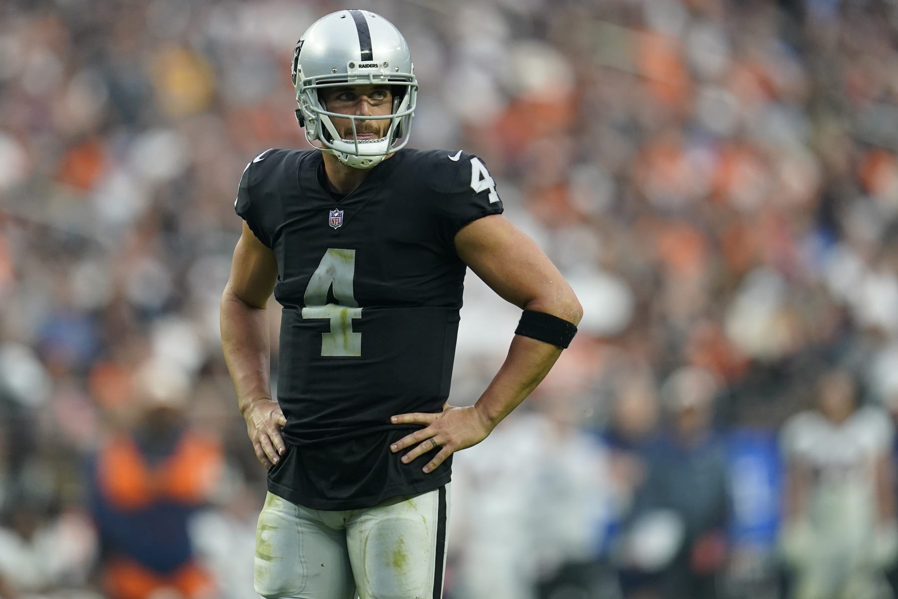 Las Vegas Raiders quarterback Derek Carr (4) looks to his bench during the second half of an NFL football game against the Denver Broncos, Sunday, Oct. 2, 2022, in Las Vegas. (AP Photo/Abbie Parr)
