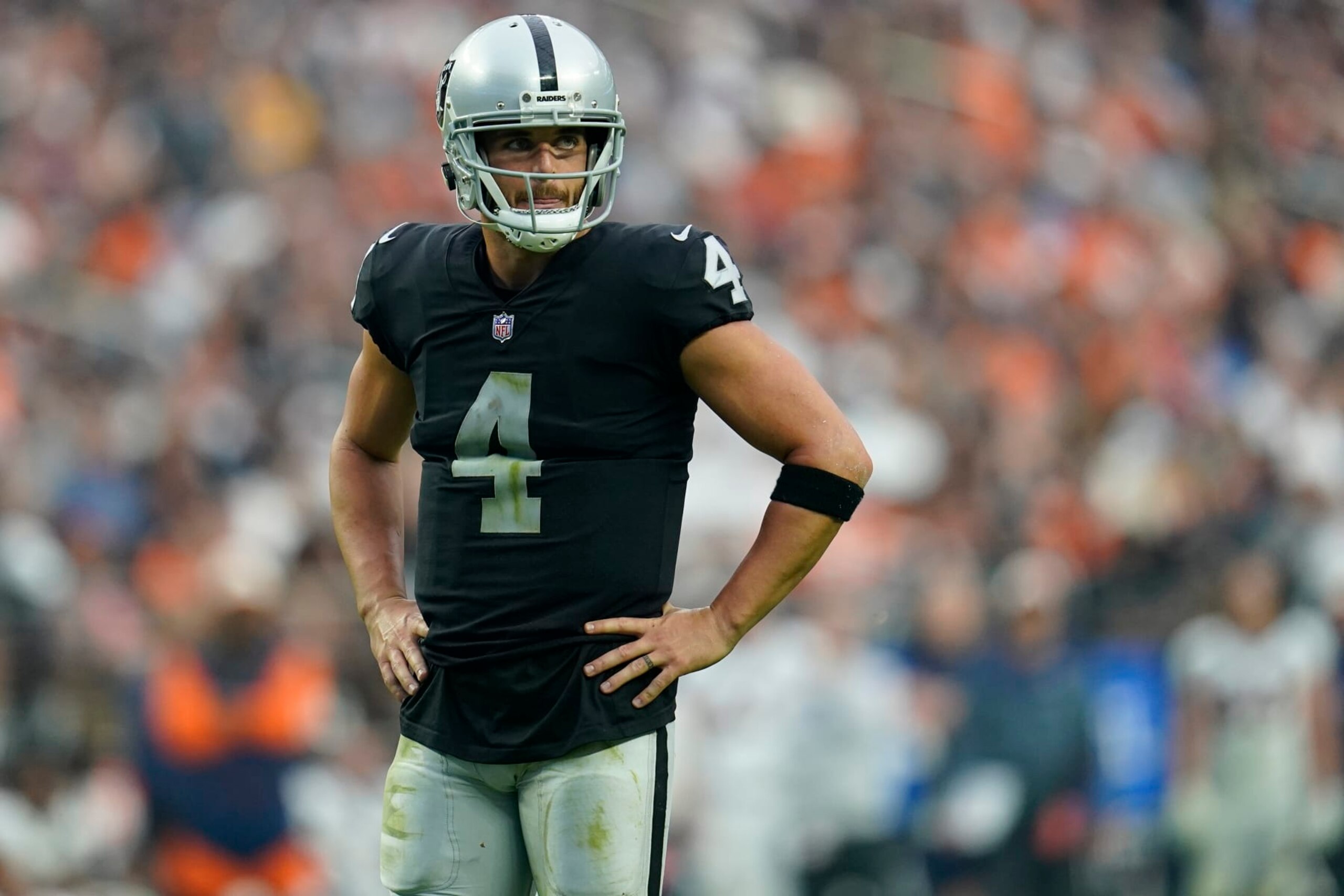 Las Vegas Raiders quarterback Derek Carr (4) looks to his bench during the second half of an NFL football game against the Denver Broncos, Sunday, Oct. 2, 2022, in Las Vegas. (AP Photo/Abbie Parr)