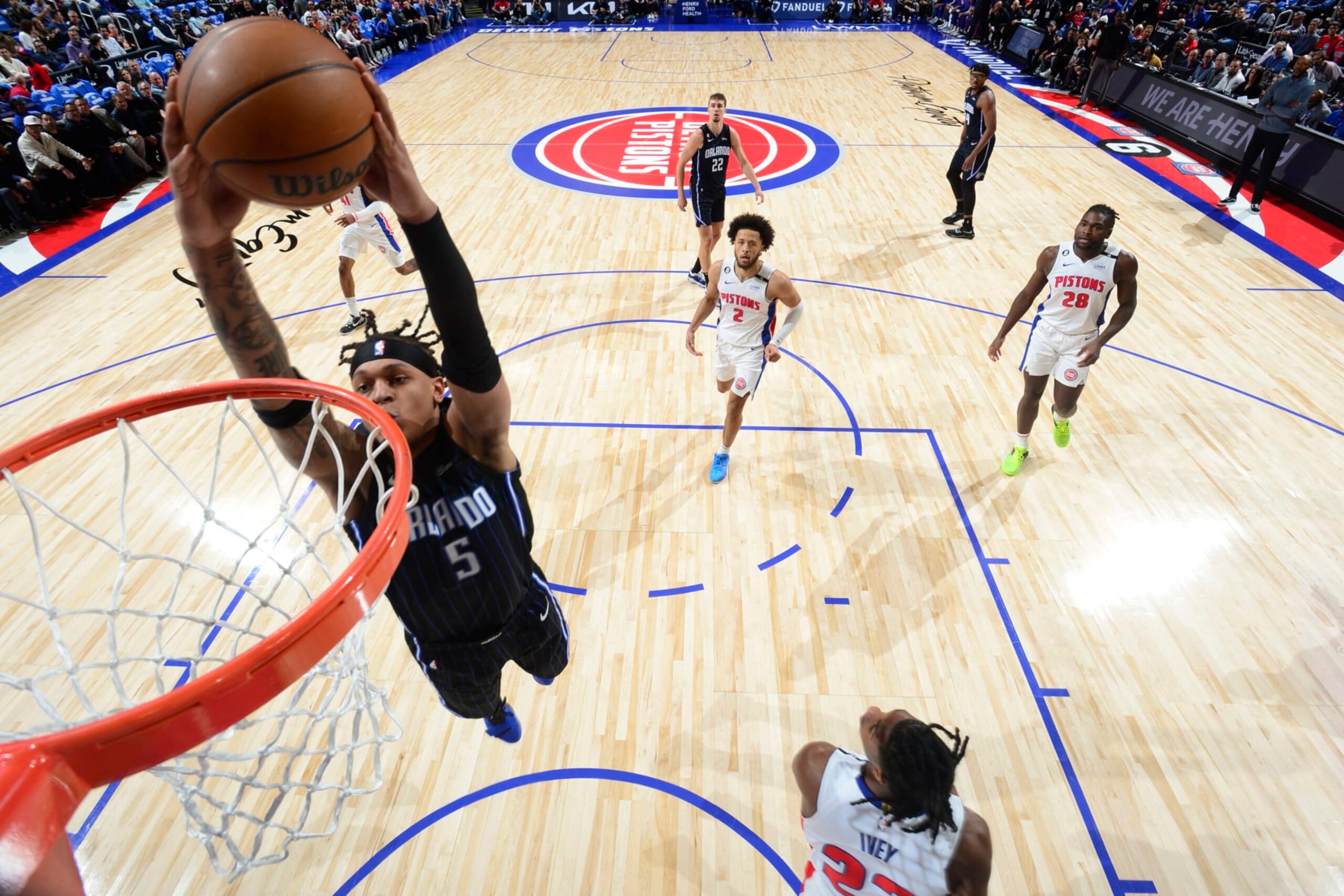 DETROIT, MI - OCTOBER 19: Paolo Banchero #5 of the Orlando Magic drives to the basket during the game against the Detroit Pistons on October 19, 2022 at Little Caesars Arena in Detroit, Michigan. NOTE TO USER: User expressly acknowledges and agrees that, by downloading and/or using this photograph, User is consenting to the terms and conditions of the Getty Images License Agreement. Mandatory Copyright Notice: Copyright 2022 NBAE (Photo by Chris Schwegler/NBAE via Getty Images) DETROIT, MI - OCTOBER 19: Paolo Banchero #5 of the Orlando Magic drives to the basket during the game against the Detroit Pistons on October 19, 2022 at Little Caesars Arena in Detroit, Michigan. NOTE TO USER: User expressly acknowledges and agrees that, by downloading and/or using this photograph, User is consenting to the terms and conditions of the Getty Images License Agreement. Mandatory Copyright Notice: Copyright 2022 NBAE (Photo by Chris Schwegler/NBAE via Getty Images)