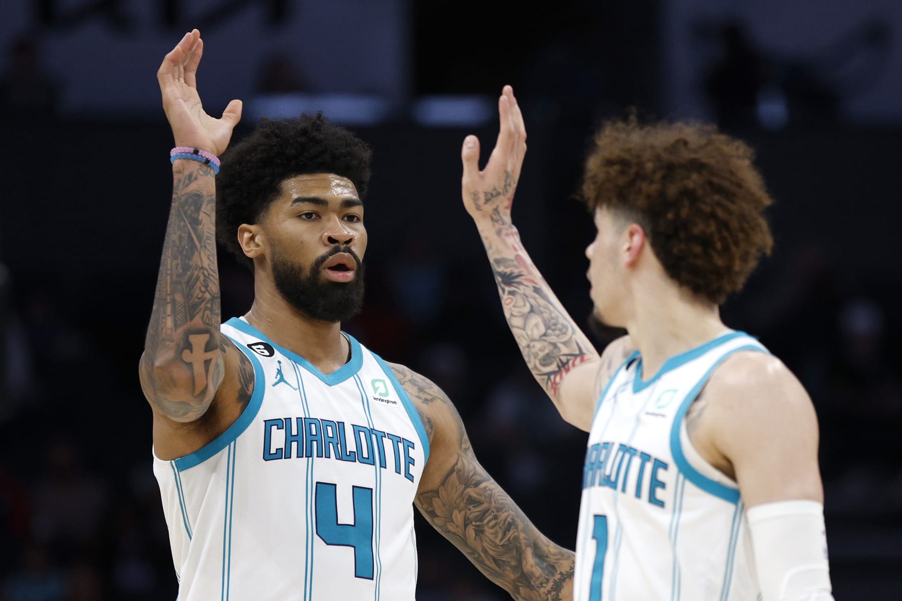 CHARLOTTE, NORTH CAROLINA - OCTOBER 10:  LaMelo Ball #1 of the Charlotte Hornets and Nick Richards #4 react during the third quarter of the game against the Washington Wizards at Spectrum Center on October 10, 2022 in Charlotte, North Carolina. NOTE TO USER: User expressly acknowledges and agrees that, by downloading and or using this photograph, User is consenting to the terms and conditions of the Getty Images License Agreement. (Photo by Jared C. Tilton/Getty Images)