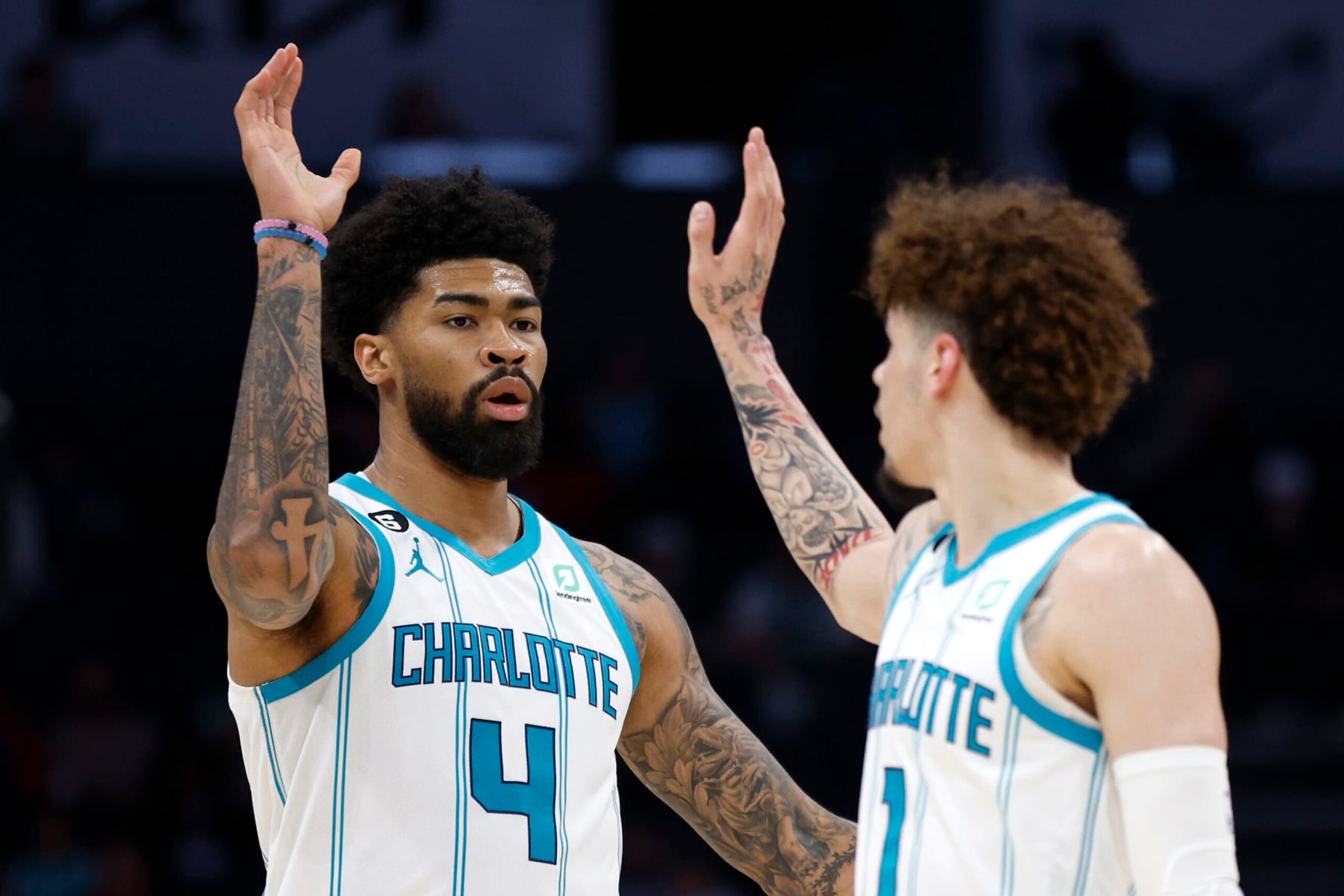 CHARLOTTE, NORTH CAROLINA - OCTOBER 10:  LaMelo Ball #1 of the Charlotte Hornets and Nick Richards #4 react during the third quarter of the game against the Washington Wizards at Spectrum Center on October 10, 2022 in Charlotte, North Carolina. NOTE TO USER: User expressly acknowledges and agrees that, by downloading and or using this photograph, User is consenting to the terms and conditions of the Getty Images License Agreement. (Photo by Jared C. Tilton/Getty Images)