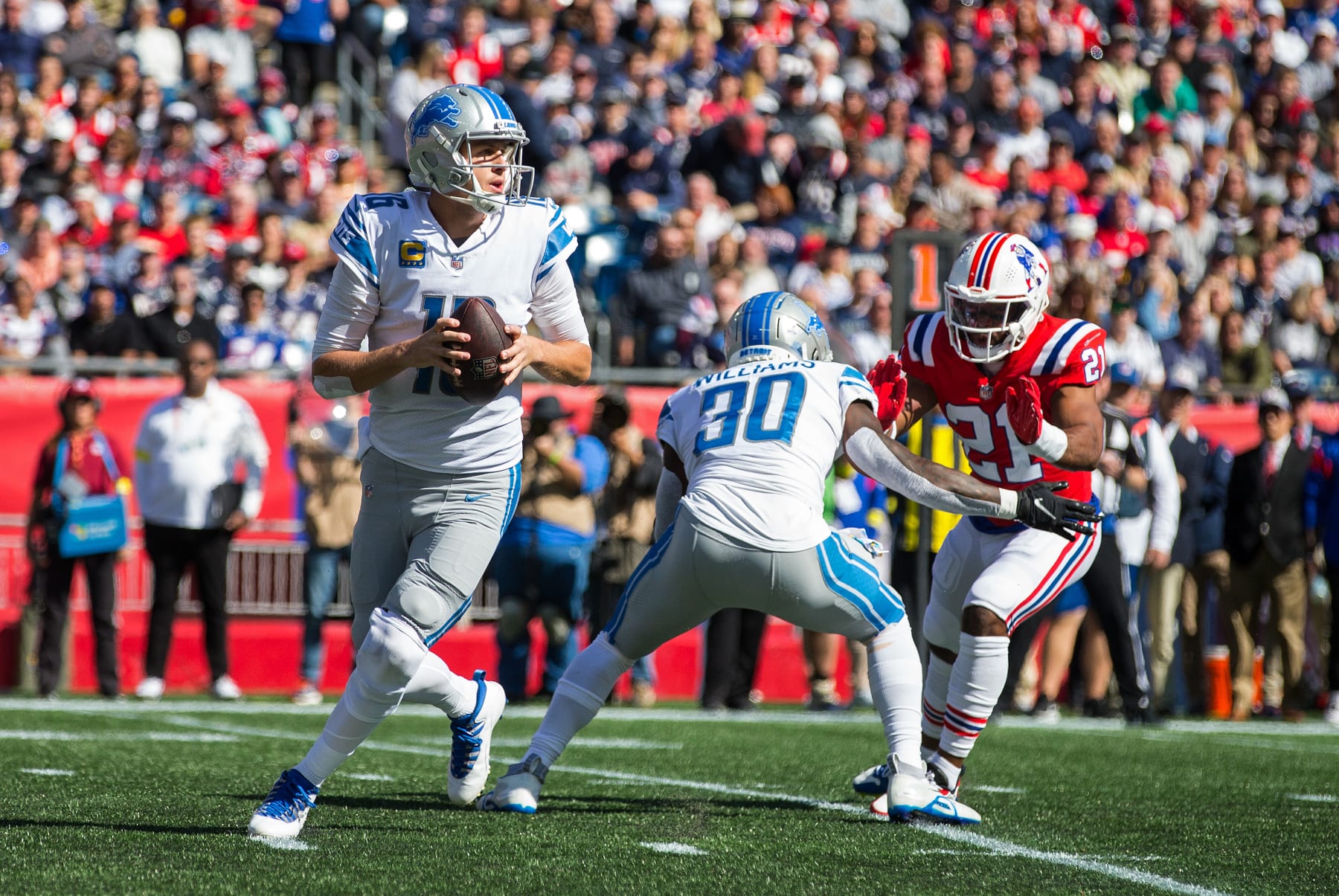 FOXBOROUGH, MA - OCTOBER 09: Detroit Lions running back Jamaal Williams (30) blocks New England Patriots safety Adrian Phillips (21) as Detroit Lions quarterback Jared Goff (16) prepares to throw a pass during a NFL game between Detroit Lions and New England Patriots on October 9, 2022, at Gillette Stadium in Foxborough, MA. (Photo by M. Anthony Nesmith/Icon Sportswire via Getty Images)
