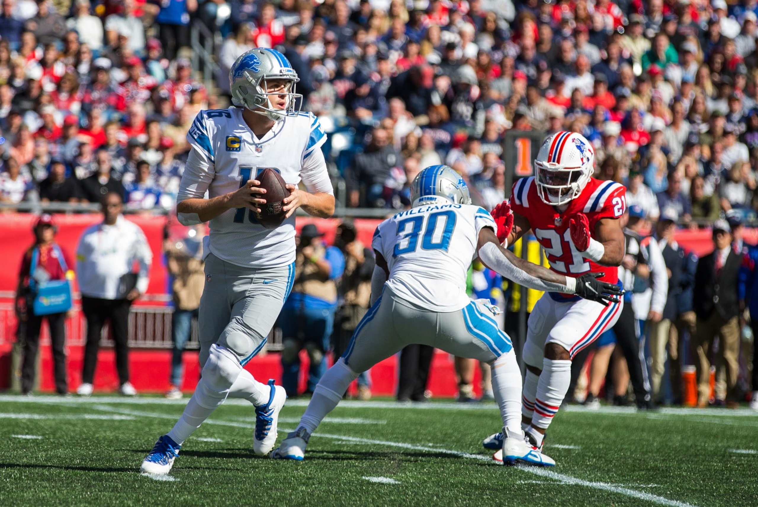 FOXBOROUGH, MA - OCTOBER 09: Detroit Lions running back Jamaal Williams (30) blocks New England Patriots safety Adrian Phillips (21) as Detroit Lions quarterback Jared Goff (16) prepares to throw a pass during a NFL game between Detroit Lions and New England Patriots on October 9, 2022, at Gillette Stadium in Foxborough, MA. (Photo by M. Anthony Nesmith/Icon Sportswire via Getty Images)