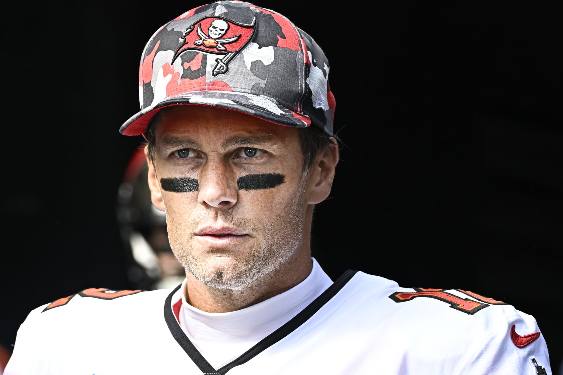 PITTSBURGH, PA - OCTOBER 16:   Tampa Bay Buccaneers quarterback Tom Brady (12) looks on to the field as he enters from the tunnel before the game between the Tampa Bay Buccaneers and the Pittsburgh Steelers at Acrisure Stadium in Pittsburgh, PA on October 16, 2022.  (Photo by Shelley Lipton/Icon Sportswire via Getty Images)
