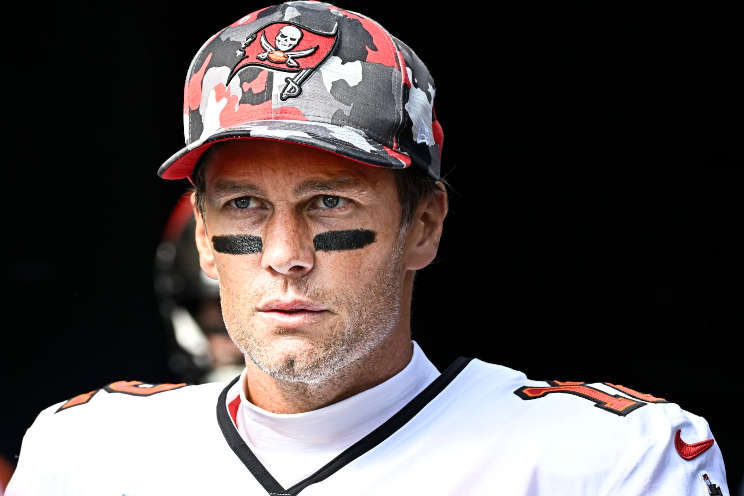 PITTSBURGH, PA - OCTOBER 16:   Tampa Bay Buccaneers quarterback Tom Brady (12) looks on to the field as he enters from the tunnel before the game between the Tampa Bay Buccaneers and the Pittsburgh Steelers at Acrisure Stadium in Pittsburgh, PA on October 16, 2022.  (Photo by Shelley Lipton/Icon Sportswire via Getty Images)