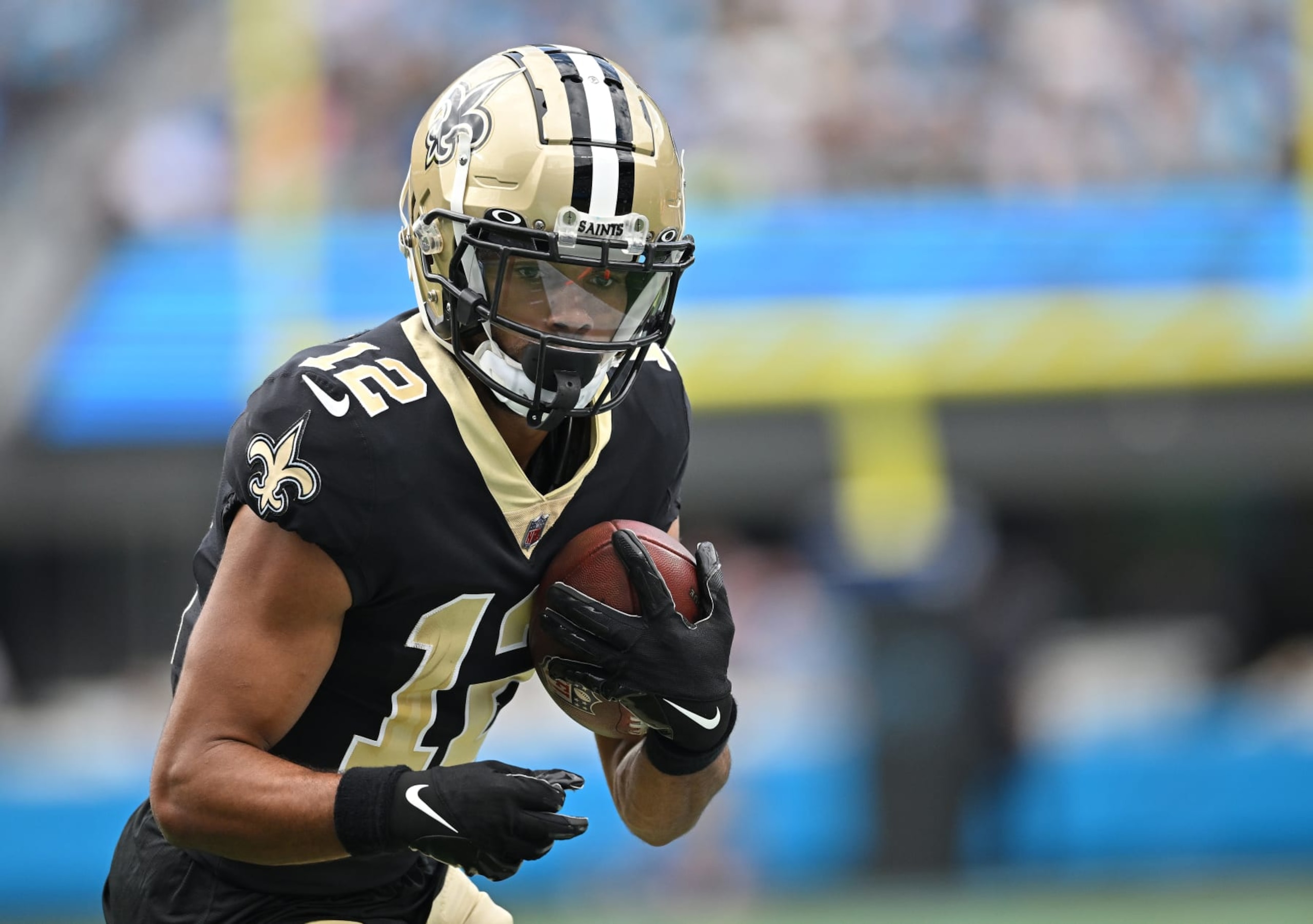 CHARLOTTE, NORTH CAROLINA - SEPTEMBER 25: Chris Olave #12 of the New Orleans Saints makes a catch against the Carolina Panthers during their game at Bank of America Stadium on September 25, 2022 in Charlotte, North Carolina. (Photo by Grant Halverson/Getty Images)