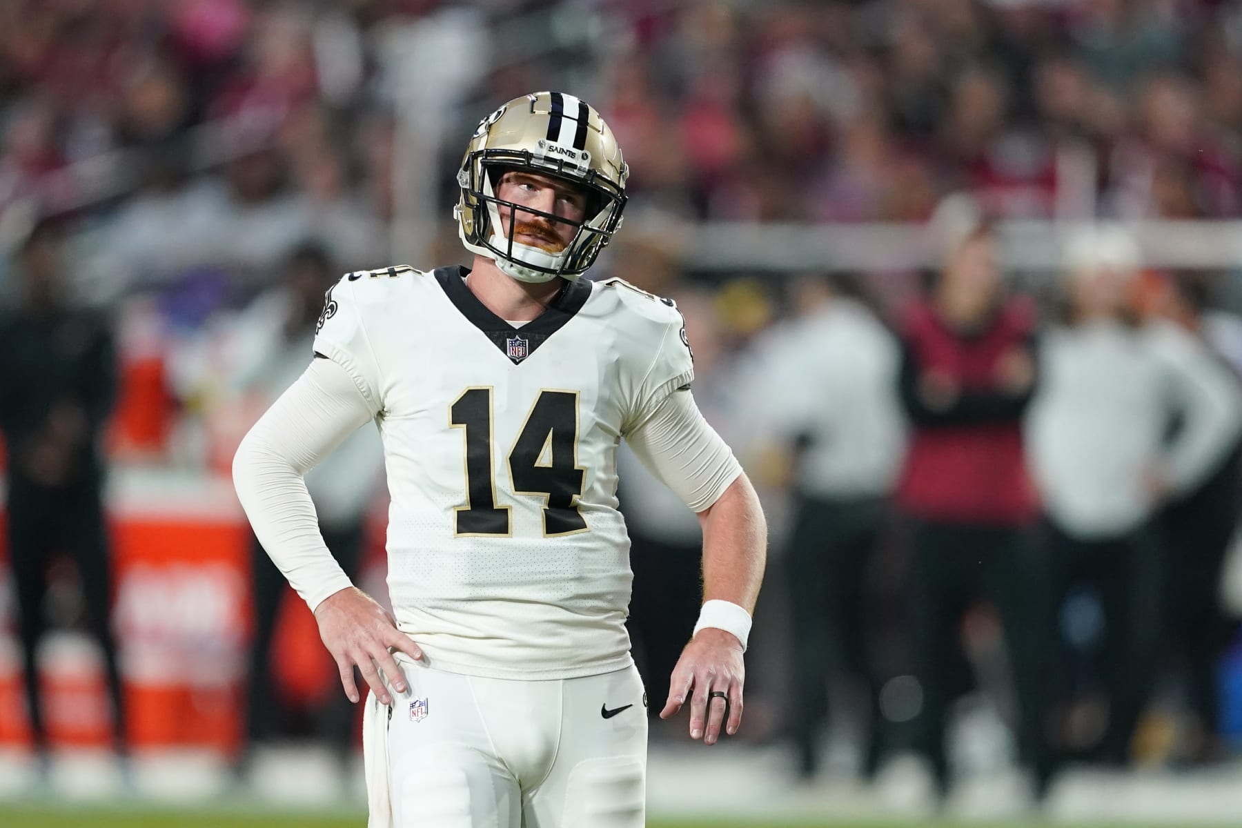 New Orleans Saints quarterback Andy Dalton (14) reacts after throwing an interception during the first half of an NFL football game against the Arizona Cardinals, Thursday, Oct. 20, 2022, in Glendale, Ariz. (AP Photo/Matt York)