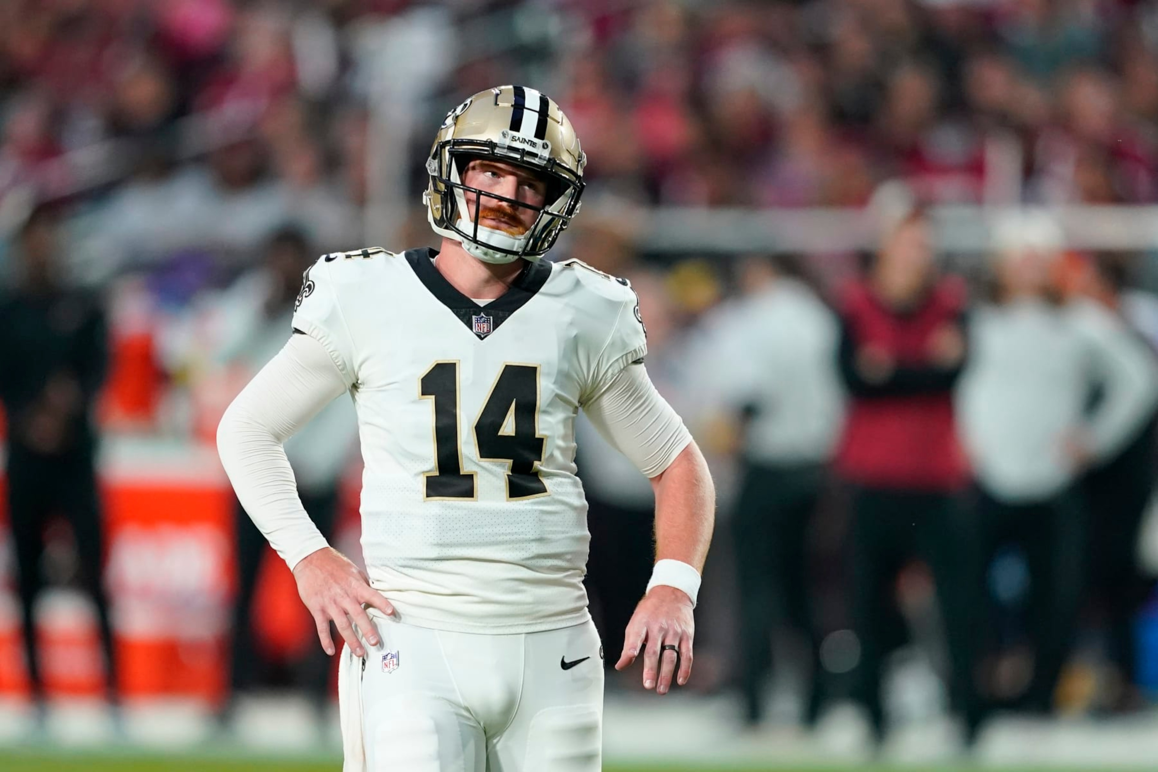 New Orleans Saints quarterback Andy Dalton (14) reacts after throwing an interception during the first half of an NFL football game against the Arizona Cardinals, Thursday, Oct. 20, 2022, in Glendale, Ariz. (AP Photo/Matt York)