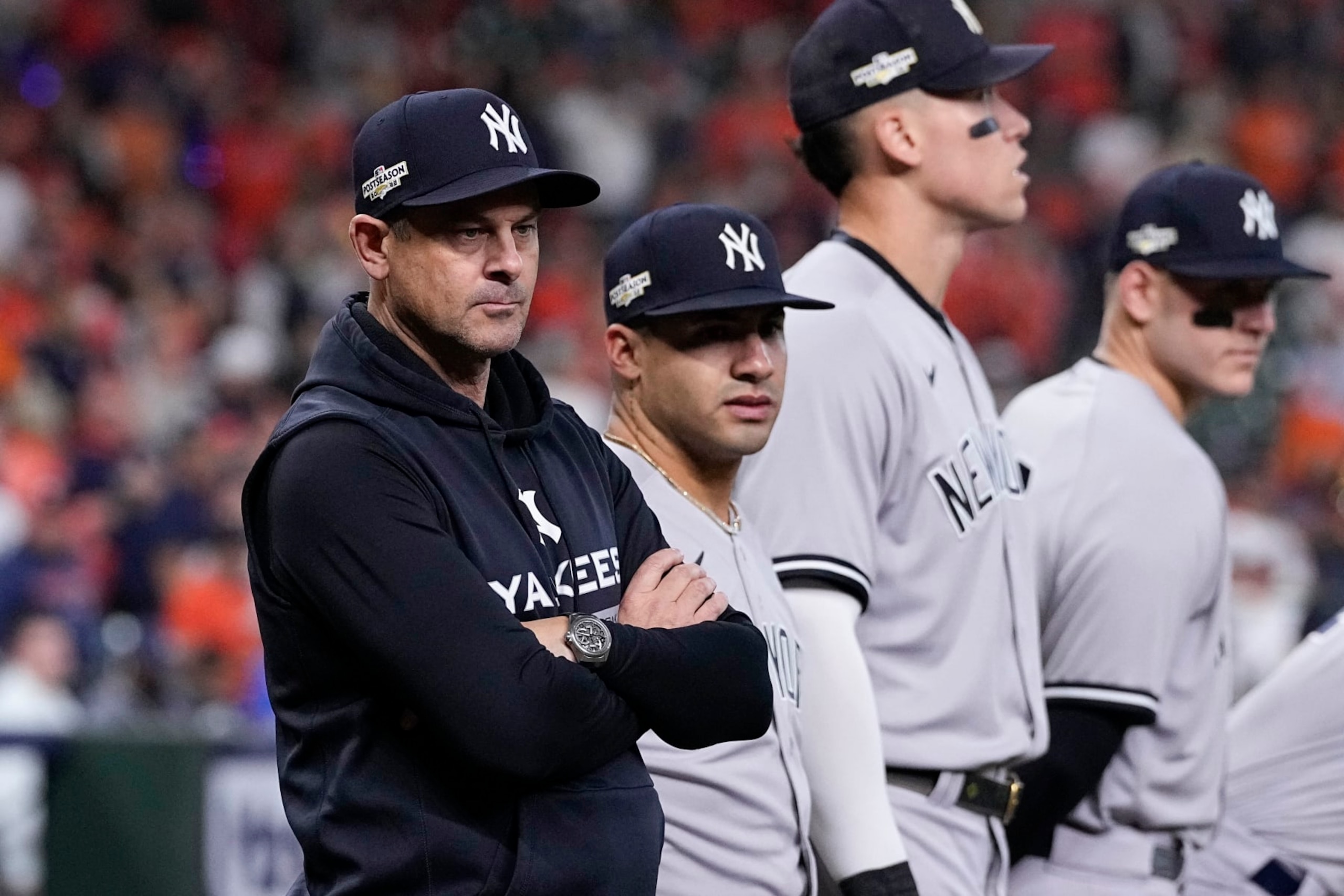New York Yankees manager Aaron Boone, left, watches teams ahead of Game 1 of baseball's American League Championship Series between the Houston Astros and the New York Yankees, Wednesday, Oct. 19, 2022, in Houston. (AP Photo/Kevin M. Cox) New York Yankees manager Aaron Boone, left, watches teams ahead of Game 1 of baseball's American League Championship Series between the Houston Astros and the New York Yankees, Wednesday, Oct. 19, 2022, in Houston. (AP Photo/Kevin M. Cox)