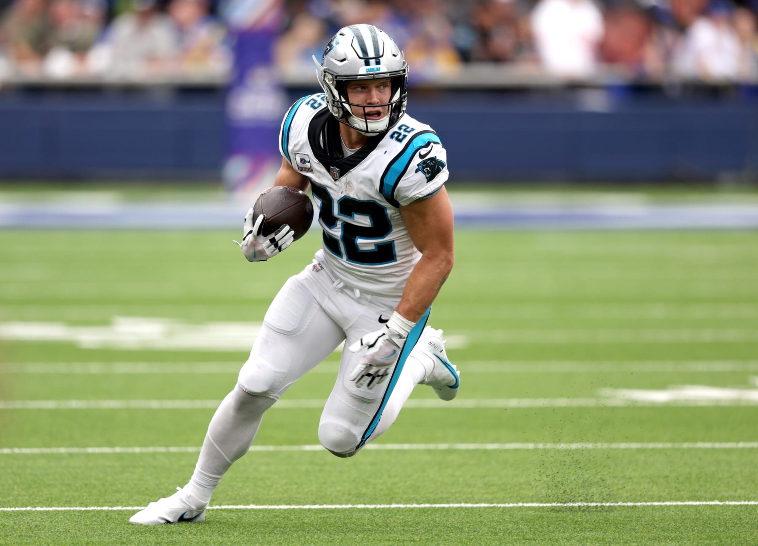 INGLEWOOD, CALIFORNIA - OCTOBER 16: Christian McCaffrey #22 of the Carolina Panthers runs after his catch during a 24-10 loss to the Los Angeles Rams at SoFi Stadium on October 16, 2022 in Inglewood, California. (Photo by Harry How/Getty Images)