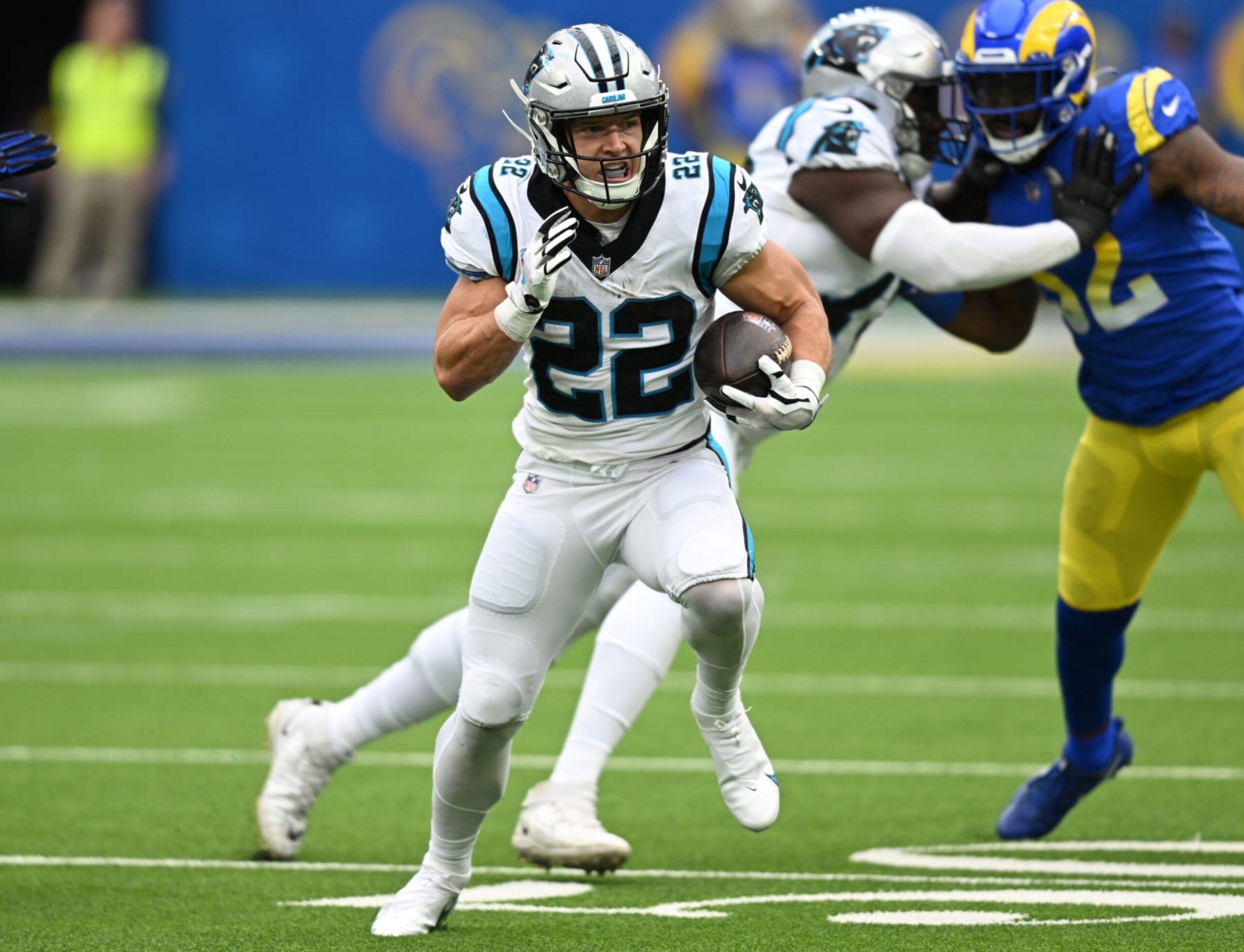 INGLEWOOD, CA - OCTOBER 16: Christian McCaffrey #22 of the Carolina Panthers runs the ball while playing the Los Angeles Rams at SoFi Stadium on October 16, 2022 in Inglewood, California. (Photo by John McCoy/Getty Images)
