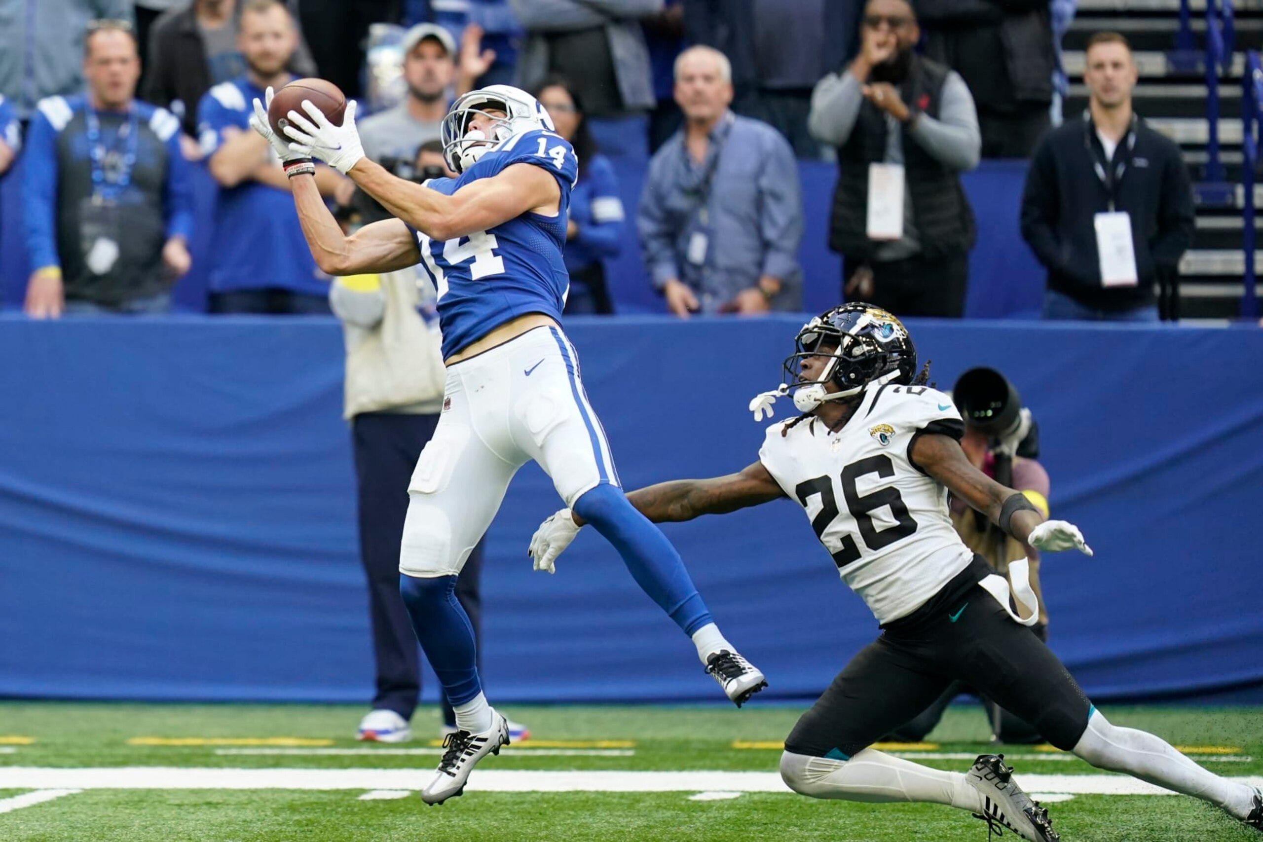 Indianapolis Colts' Alec Pierce (14) makes a touchdown reception against Jacksonville Jaguars' Shaquill Griffin (26) during the second half of an NFL football game, Sunday, Oct. 16, 2022, in Indianapolis.(AP Photo/Michael Conroy)