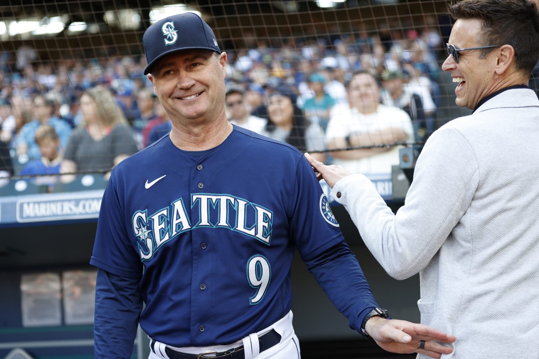 SEATTLE, WASHINGTON - OCTOBER 01: Manager Scott Servais #9 and general manager Jerry Dipoto of the Seattle Mariners look on before the game against the Oakland Athletics at T-Mobile Park on October 01, 2022 in Seattle, Washington. (Photo by Steph Chambers/Getty Images)